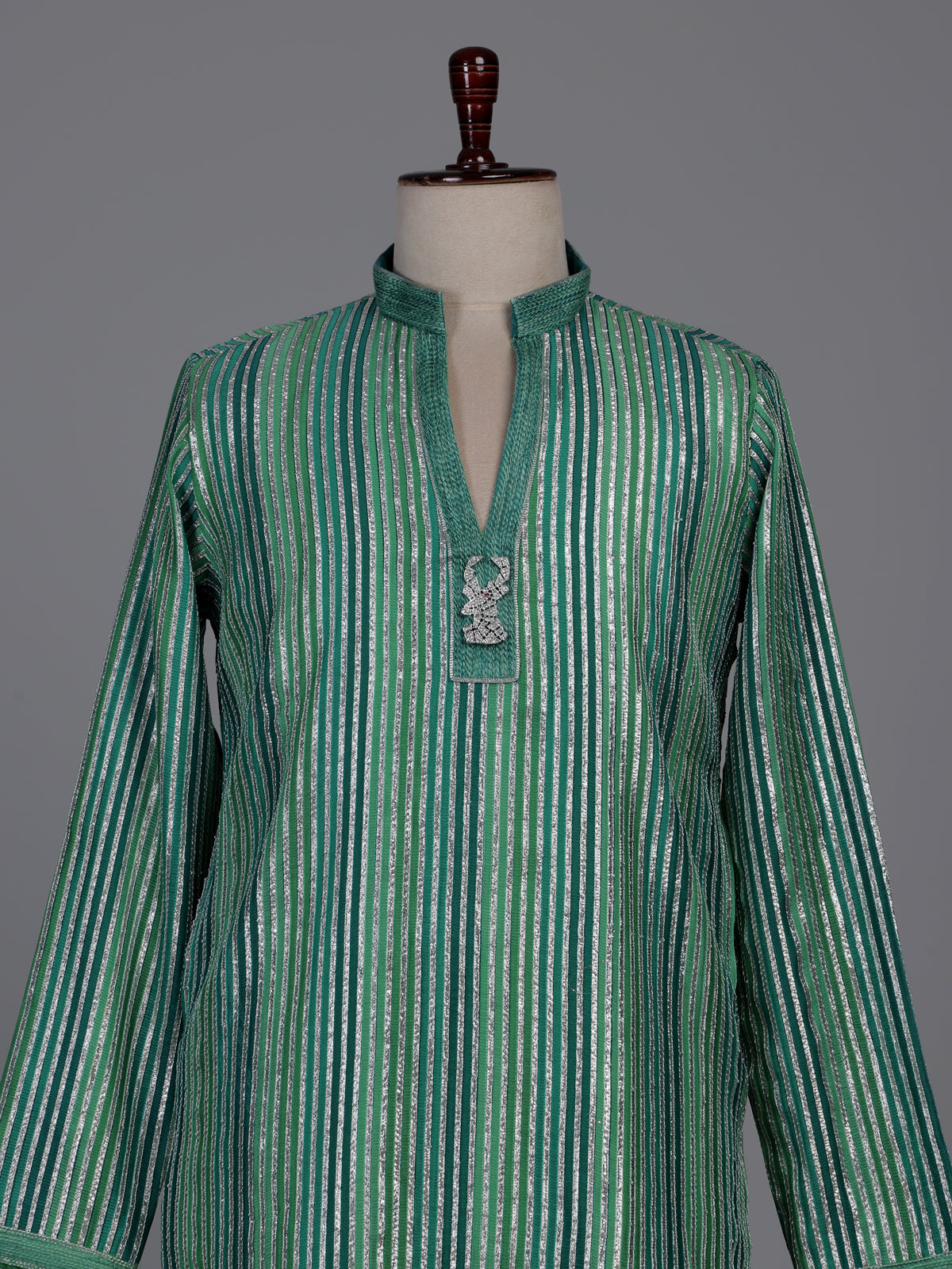 Emerald green kurta suit with shimmering silver gota patti stripes