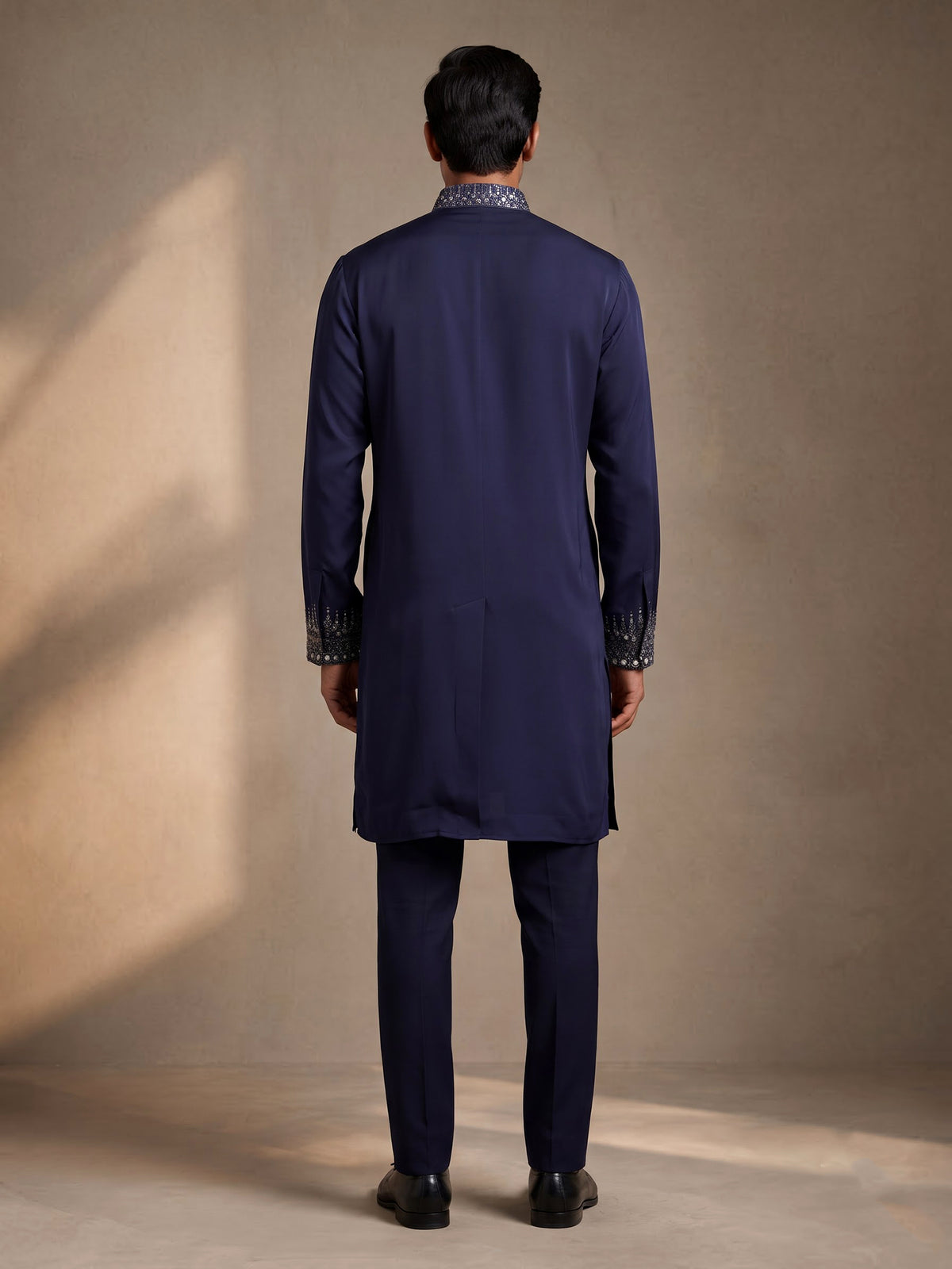 Deep navy crepe silk kurta suit with antique silver embroidered bib