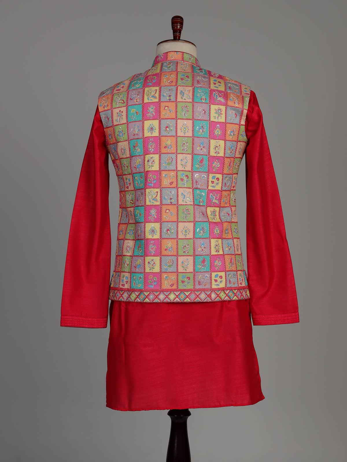 Deep magenta silk waistcoat set with floral texture and sequins