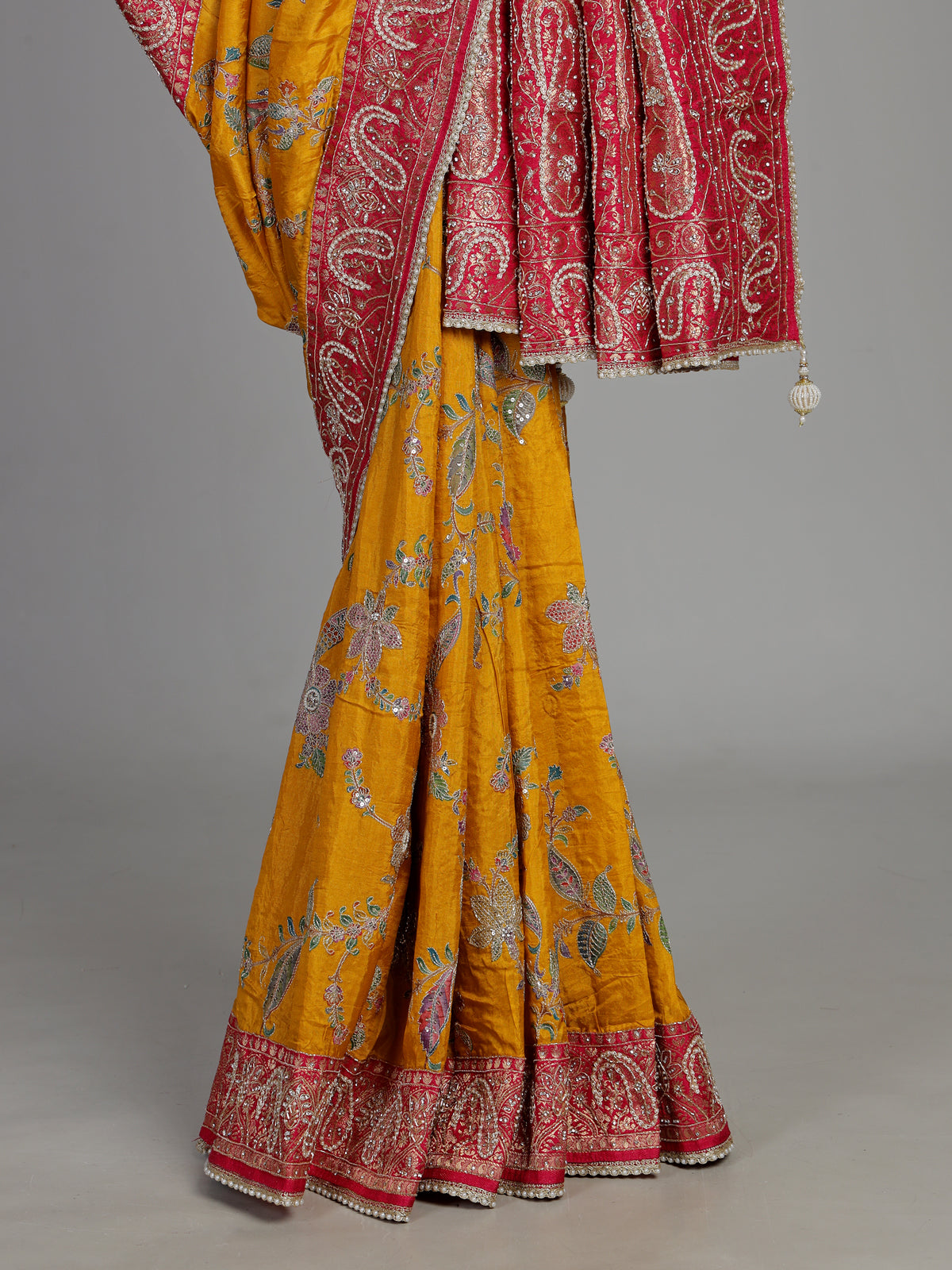 Mustard yellow pashmina saree with floral embroidery and contrast pallu