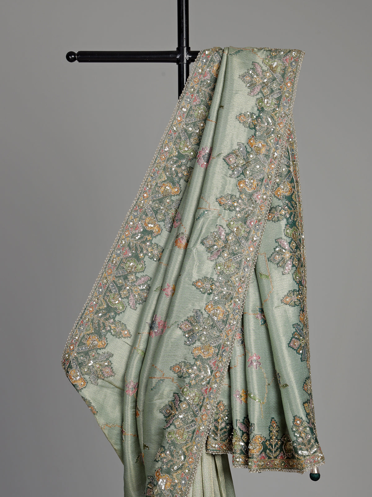 Pastel mint green pashmina saree with floral and bird embroidery