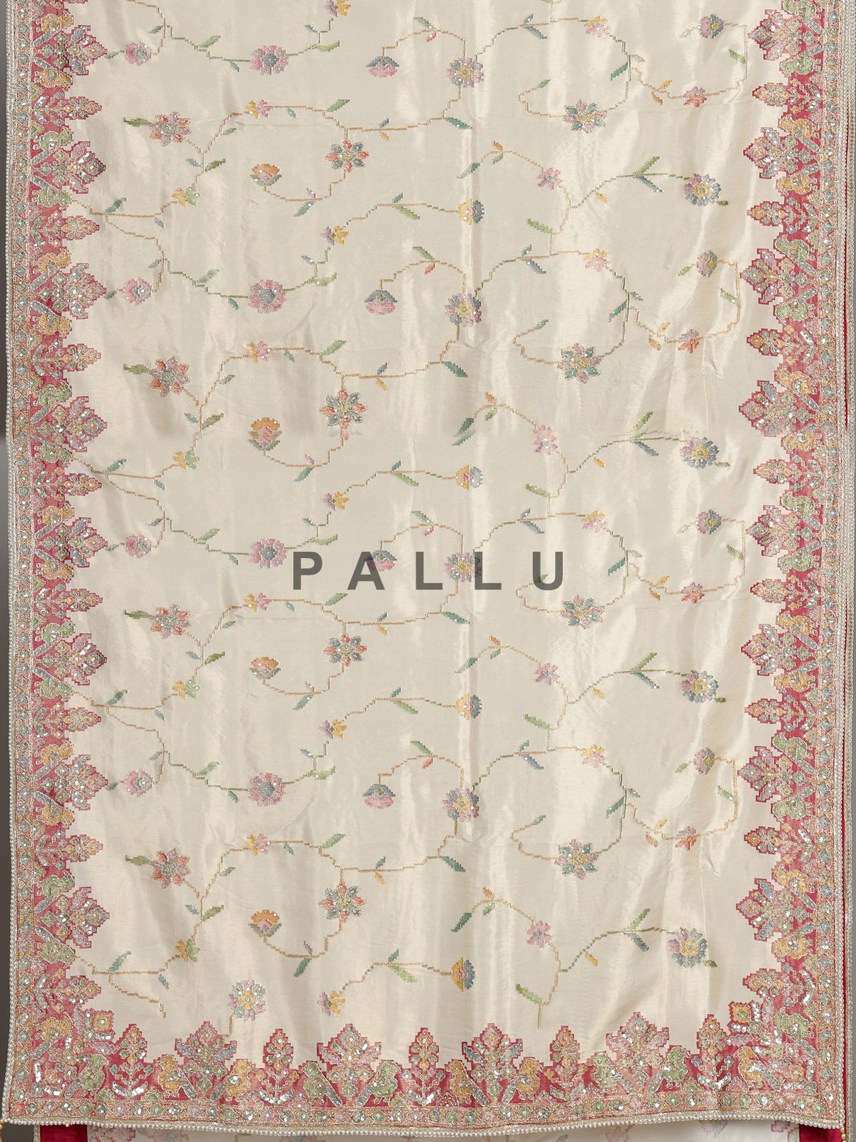 Cream pojisan silk saree with floral motifs and ornate zardosi embroidery