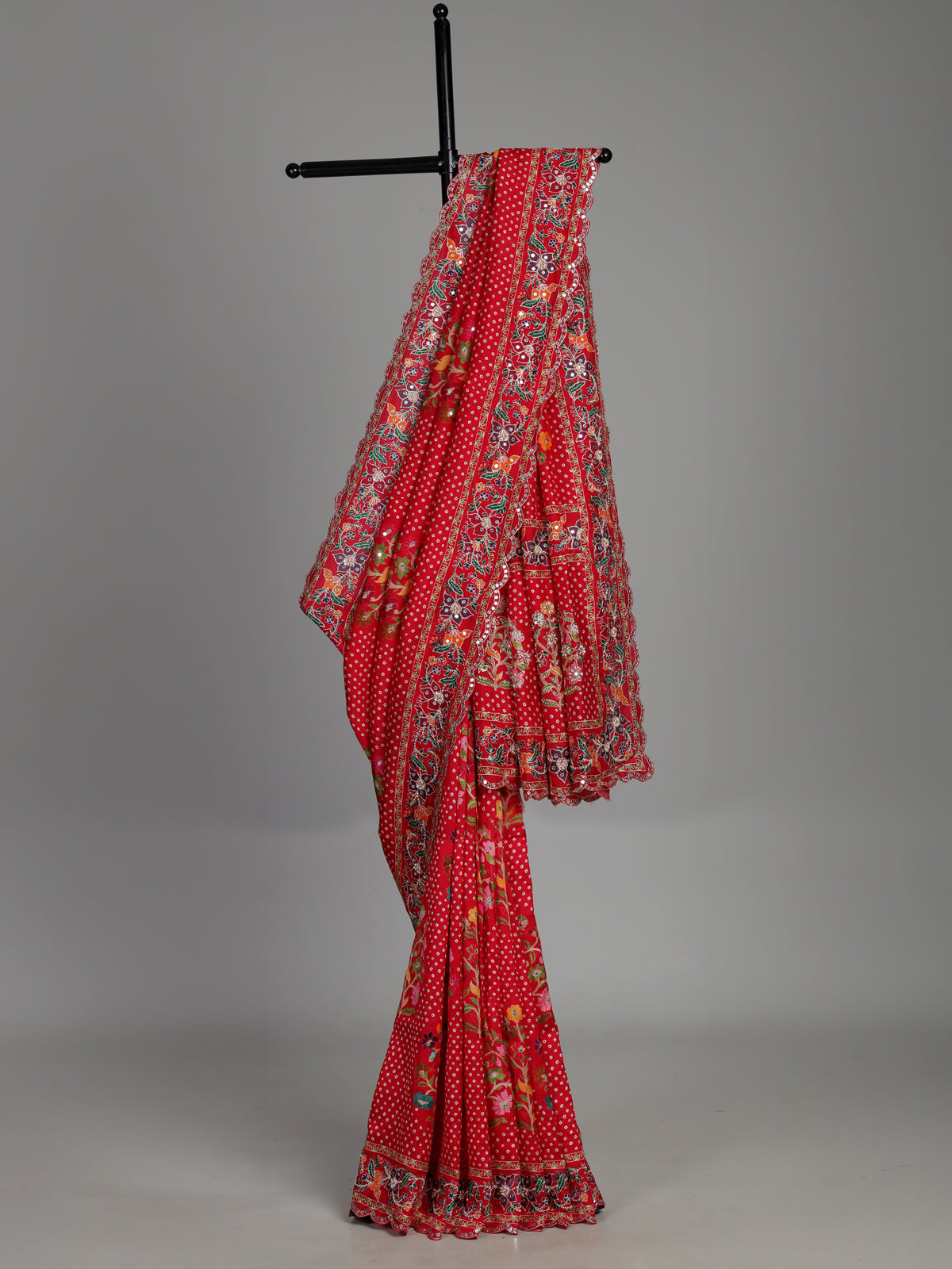 Red muslin silk saree with bandhani print and traditional aabla embellishments