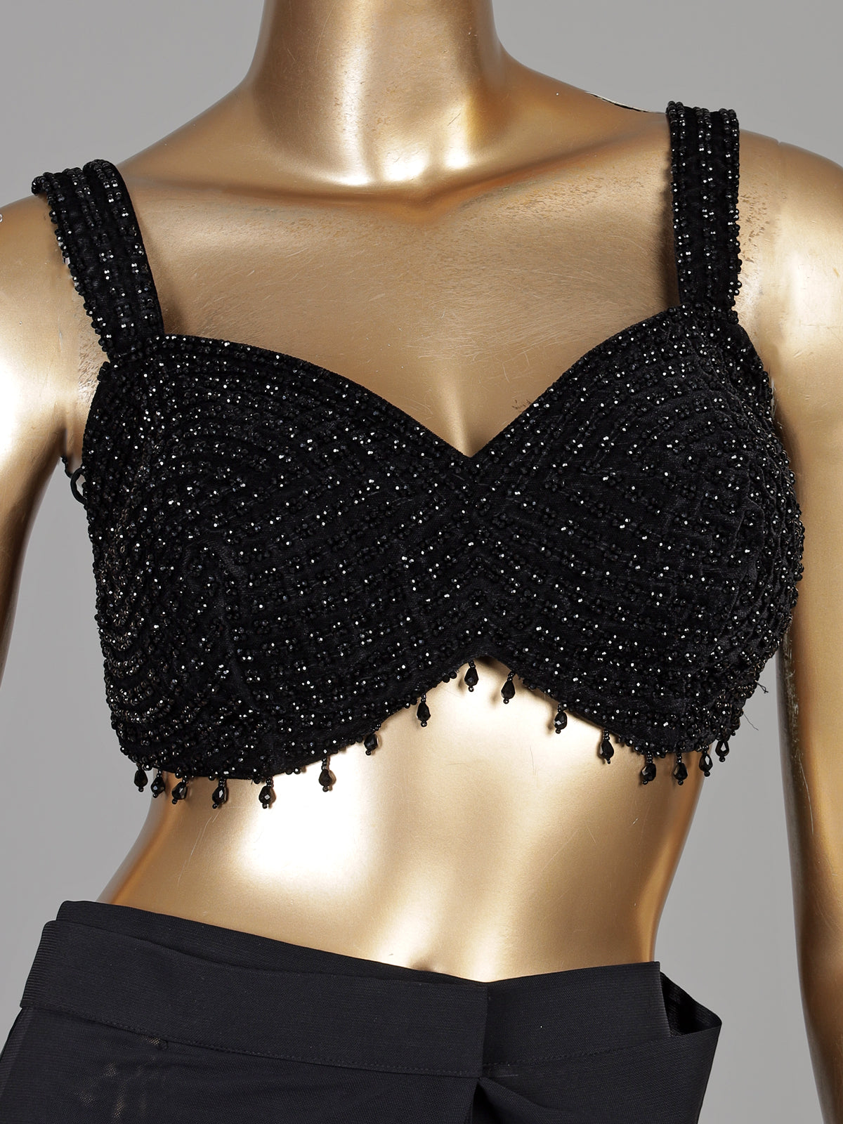 Black georgette ready-to-wear saree with pearl tassel blouse