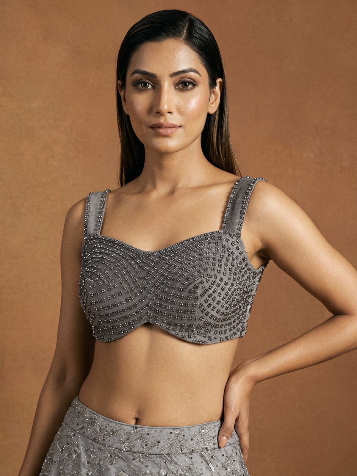 Grey net lehenga choli with pearl embellishments and designer detailing