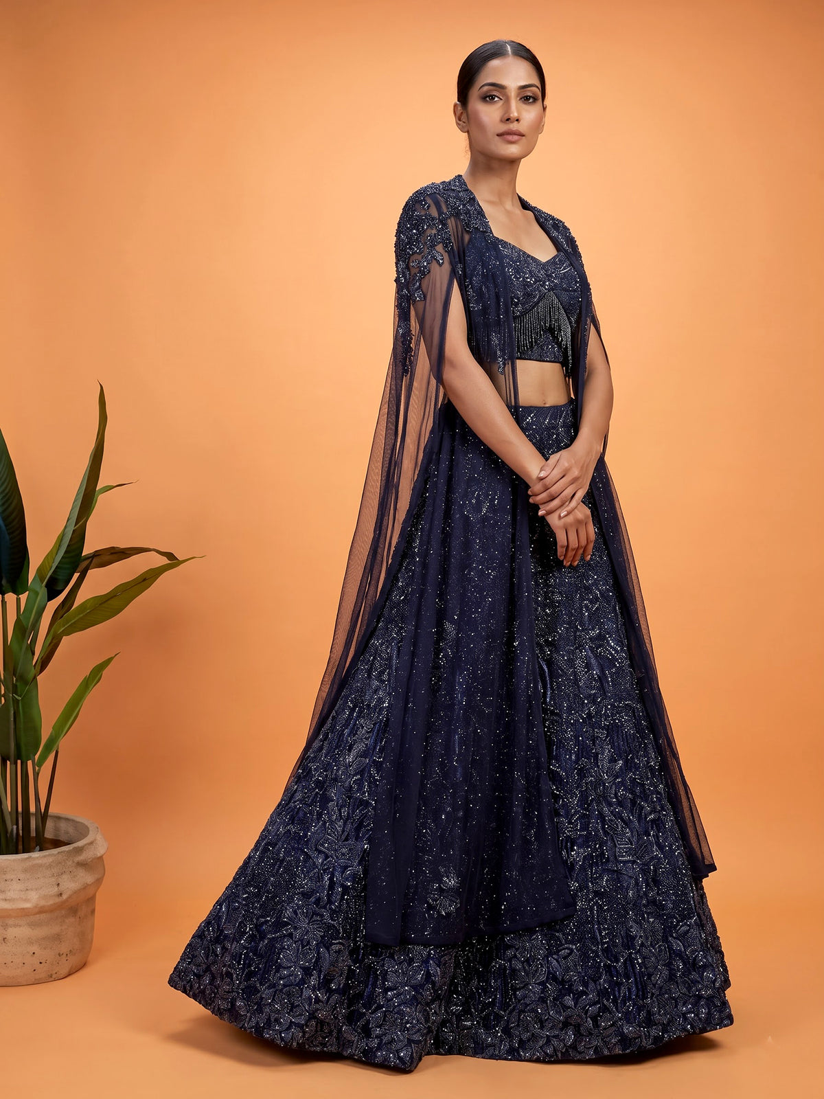 Blue net lehenga choli with designer shrug and zardosi embellishments