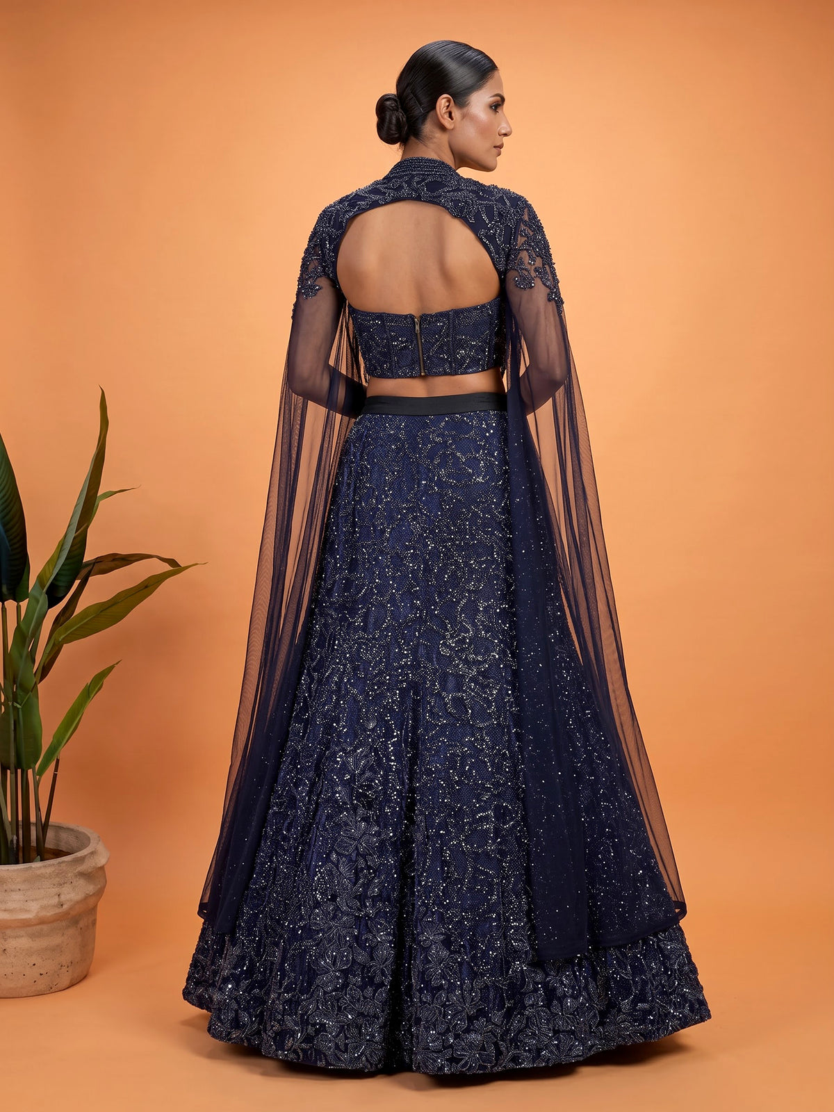 Blue net lehenga choli with designer shrug and zardosi embellishments