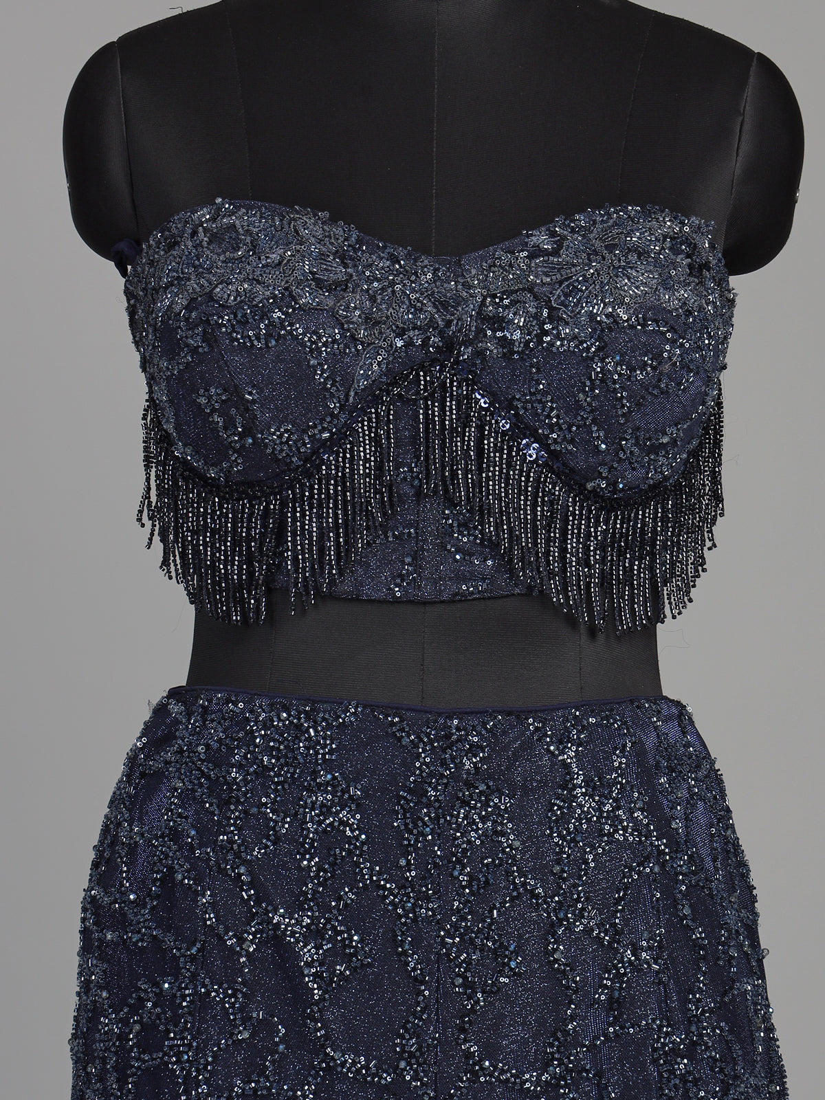Blue net lehenga choli with designer shrug and zardosi embellishments