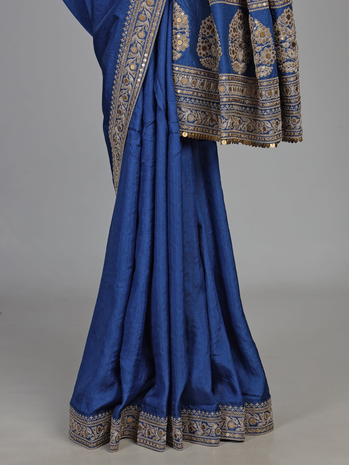 Royal blue silk saree with intricate embroidery and sequin detailing