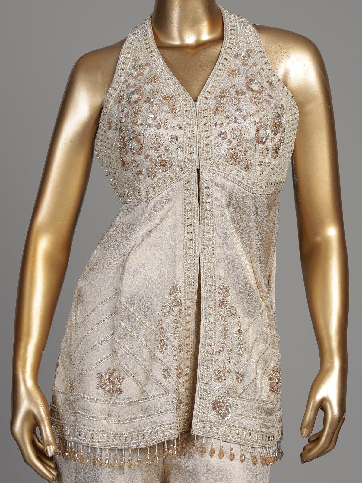 Cream brocade silk palazzo suit with rich cutdana detailing