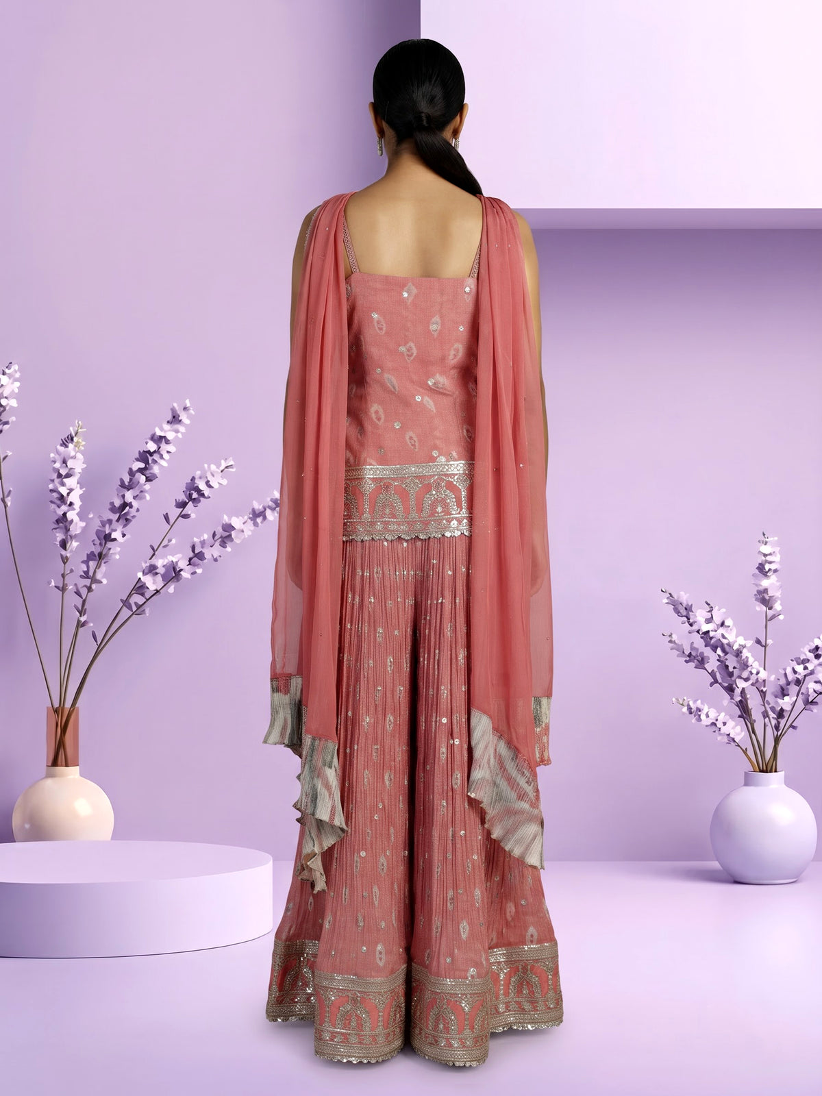 Peach silk palazzo suit with ornate embroidery and dupatta