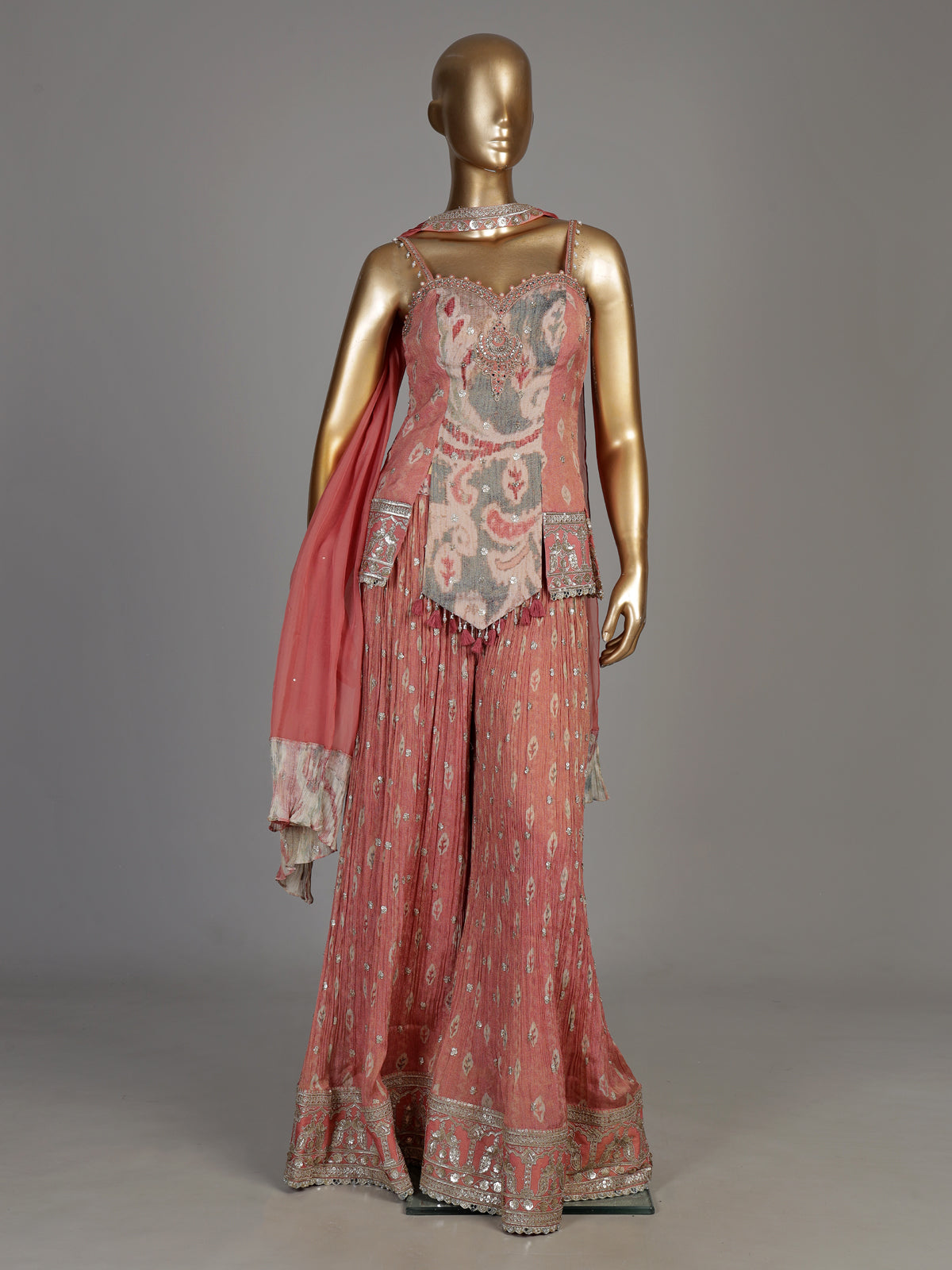 Peach silk palazzo suit with ornate embroidery and dupatta