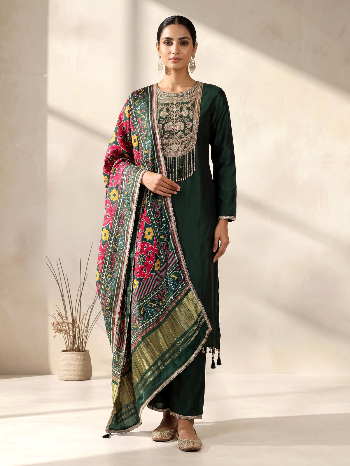 Bottle green silk anarkali suit with patola printed dupatta