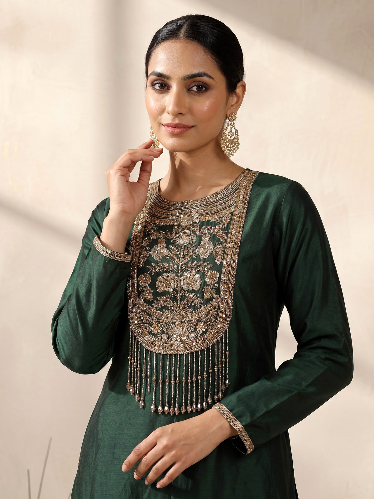 Bottle green silk anarkali suit with patola printed dupatta
