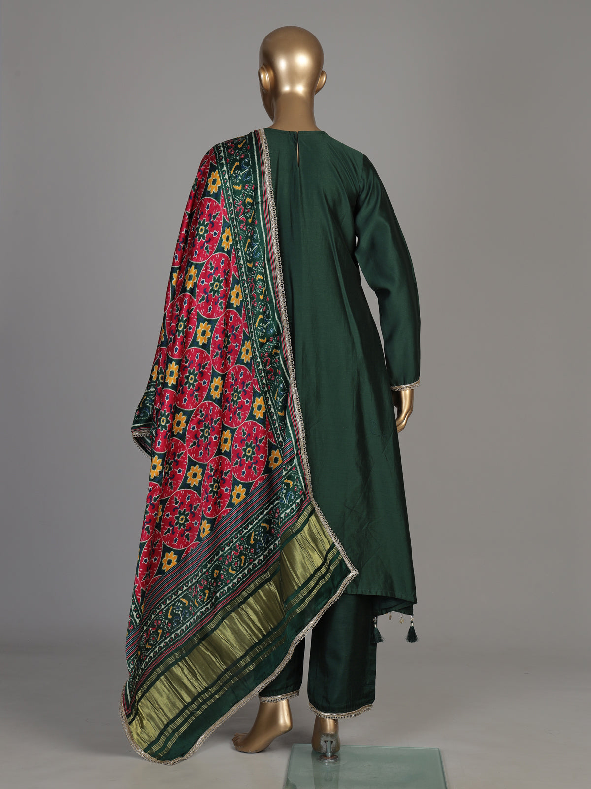 Bottle green silk anarkali suit with patola printed dupatta
