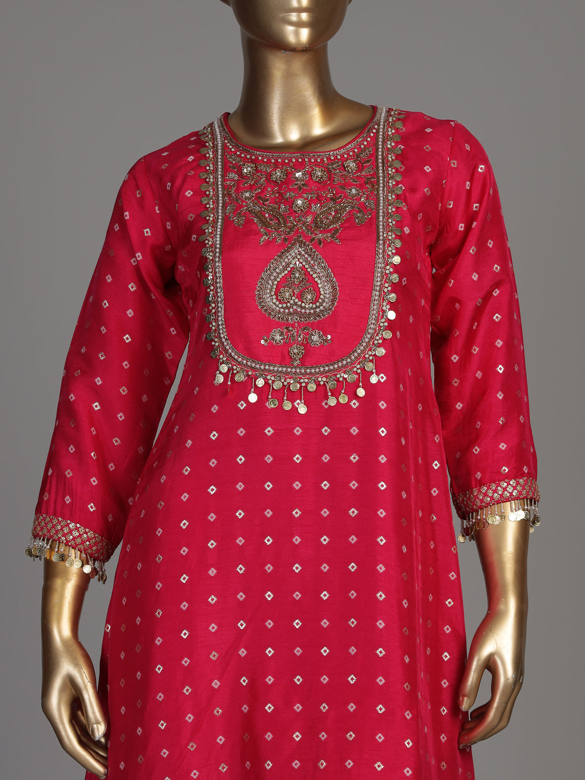 Rani pink silk bandhani suit with an embellished yoke