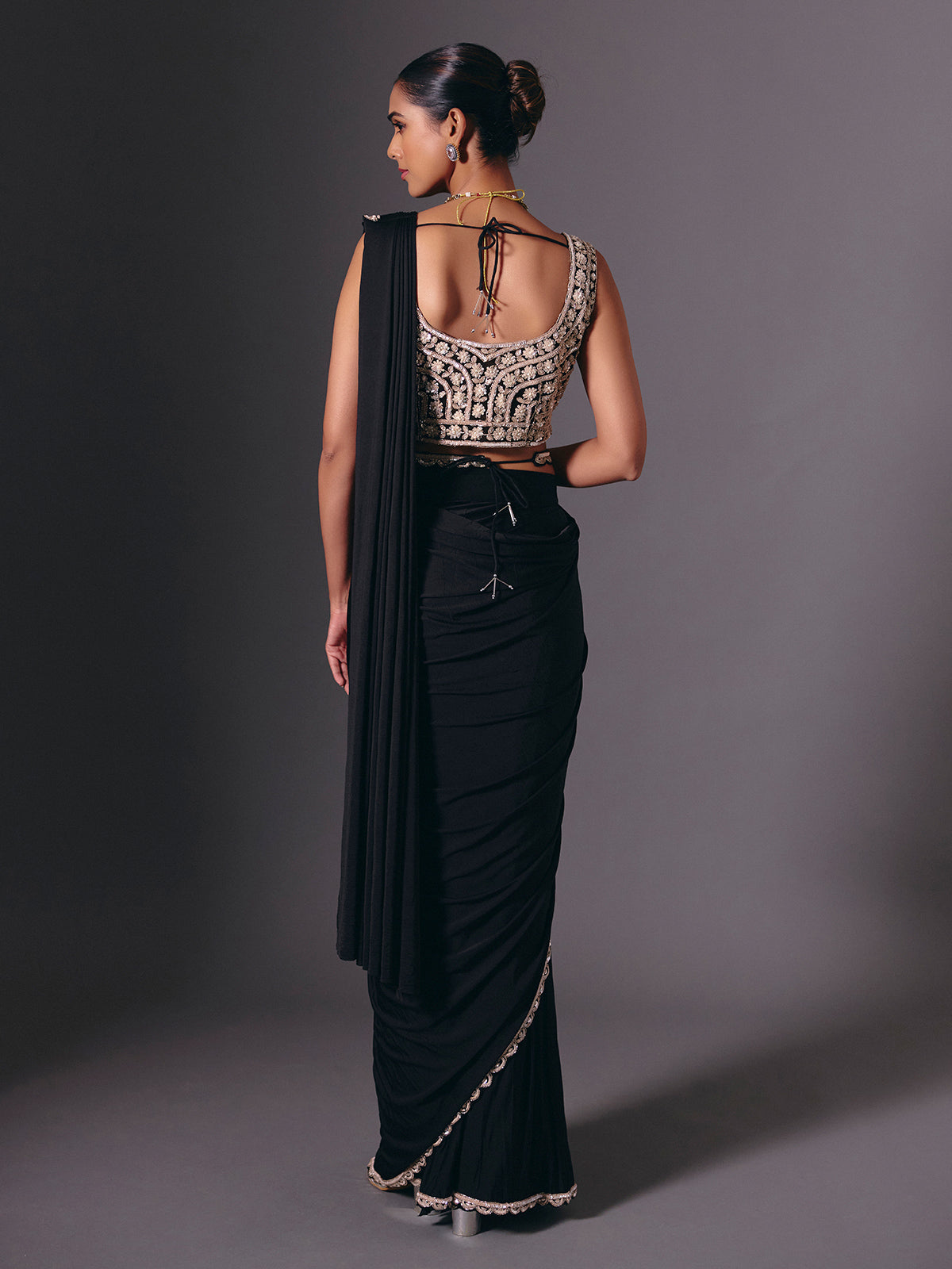 Black lycra saree with sequins and cutdana embellishments