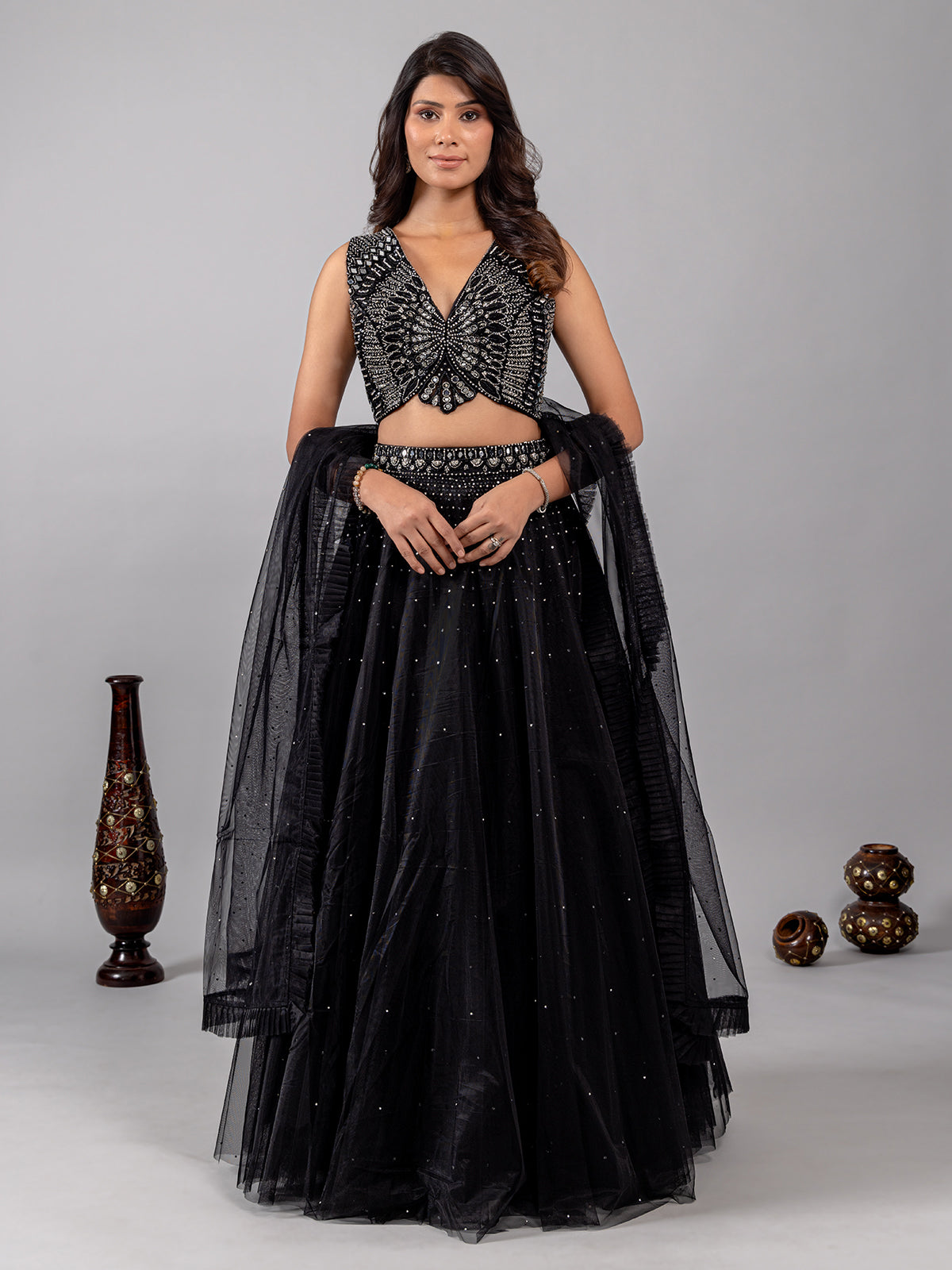 Black net lehenga choli with shimmering mirror accents