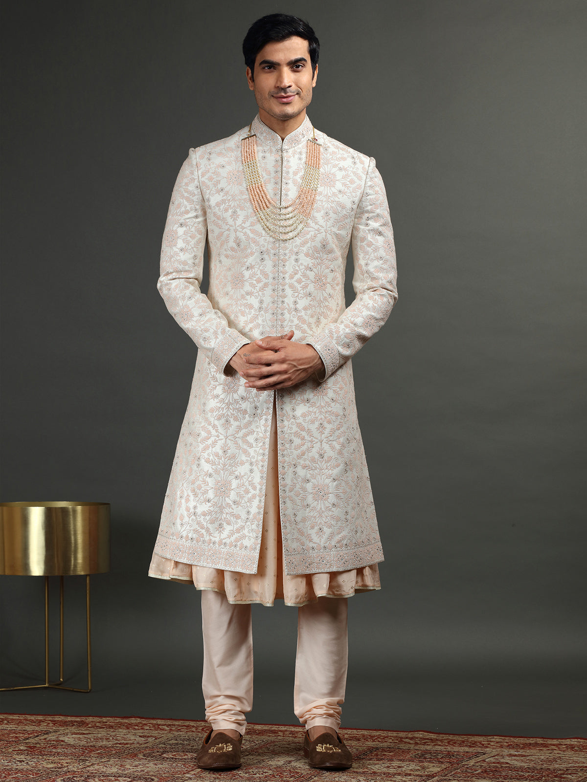 Cream and peach groom sherwani in raw silk