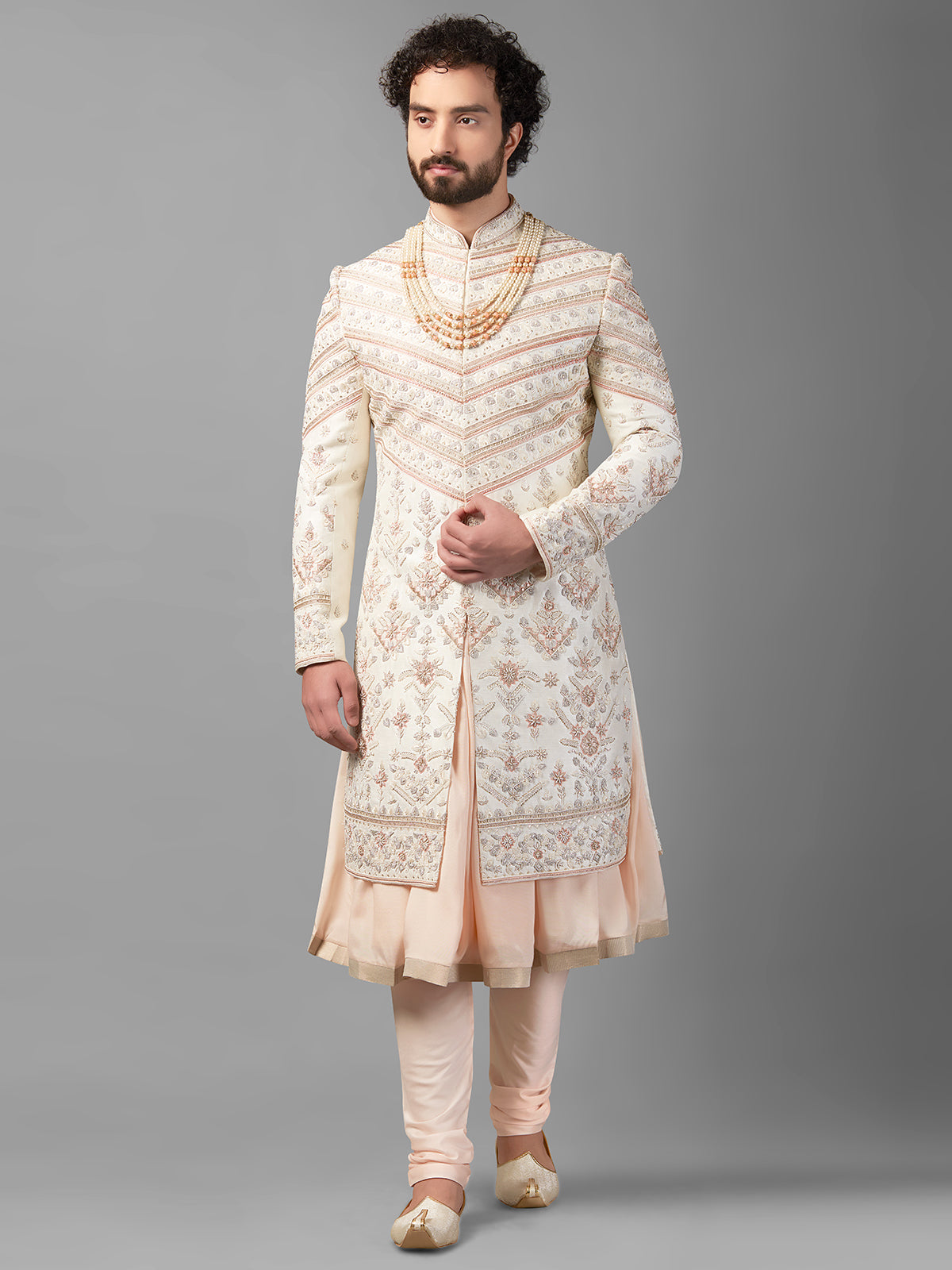 Cream and peach peshwai style sherwani