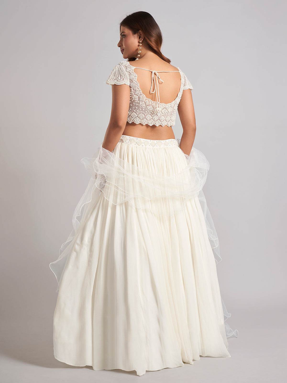 Cream georgette lehenga choli with pearl work