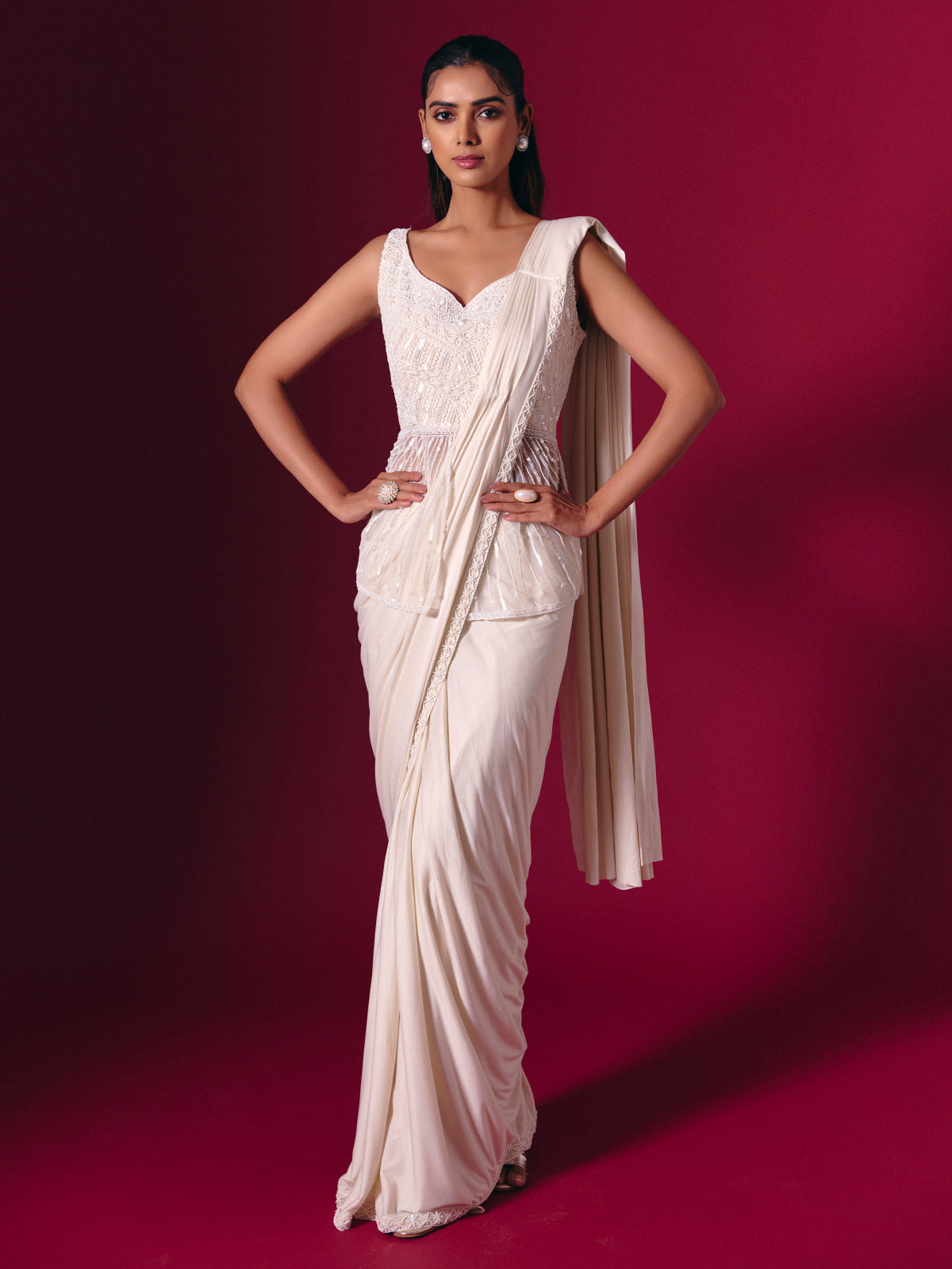 Cream lycra saree with subtle festive embellishments