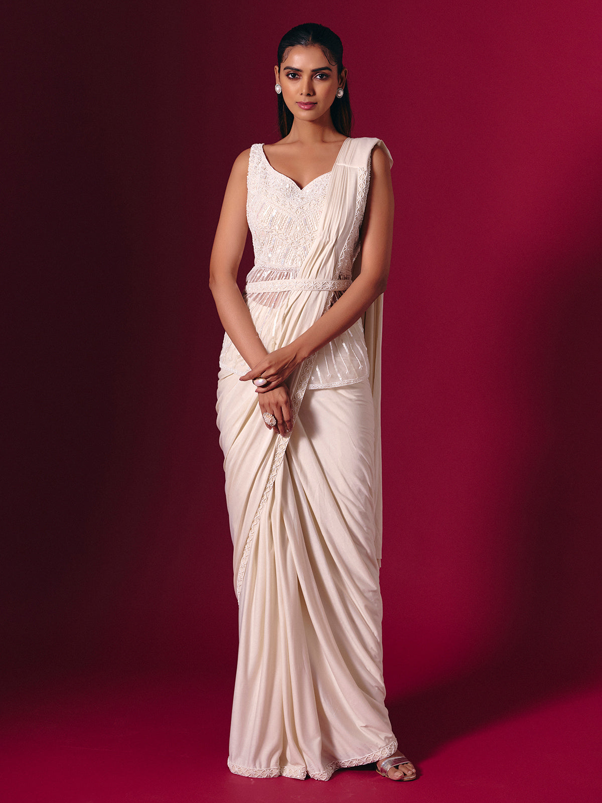 Cream lycra saree with subtle festive embellishments