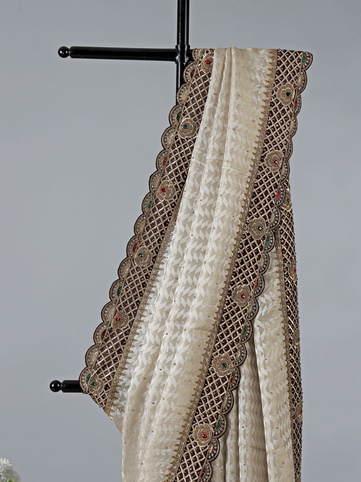 Cream silk saree with stone and zardosi work