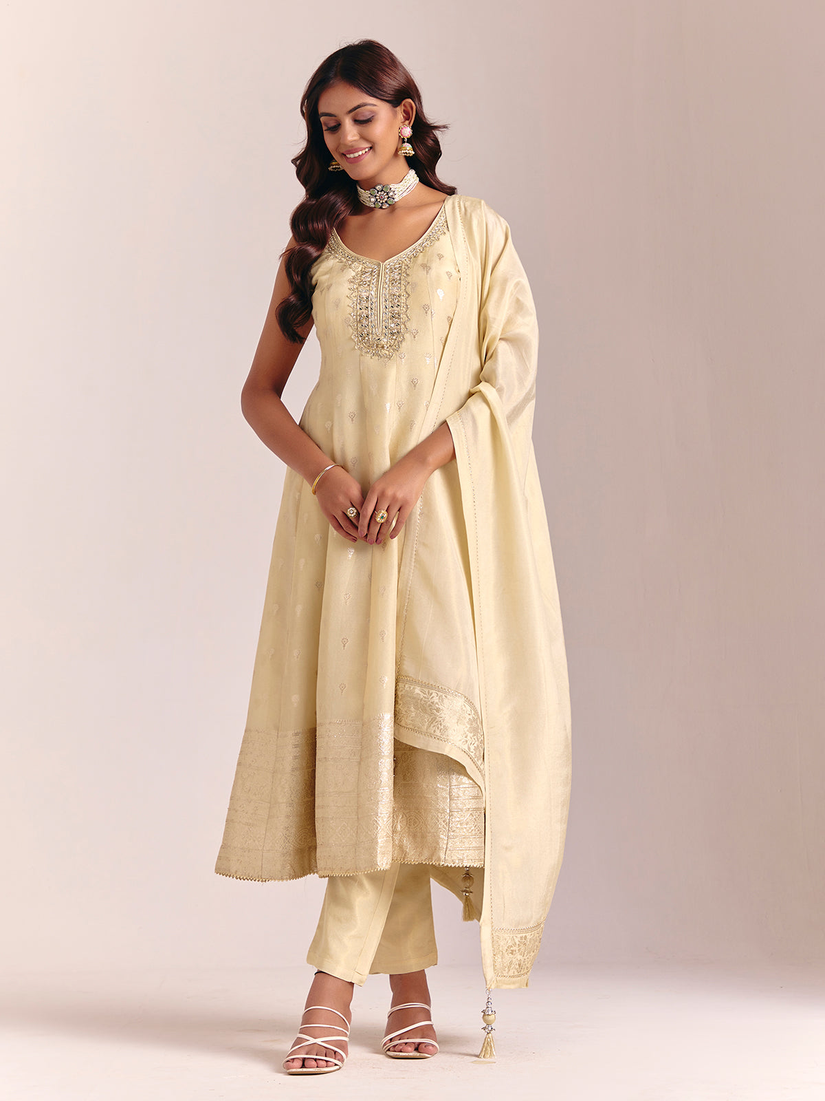 Cream silk sleeveless salwarsuit with dupatta