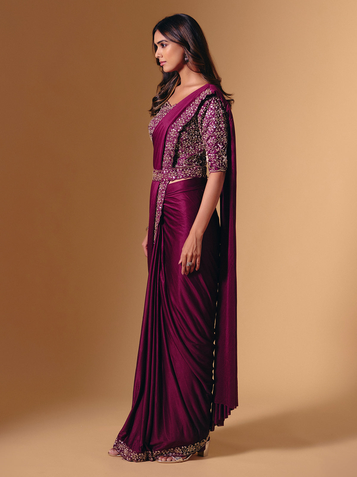 Dark purple lycra saree with shimmering cutdana design