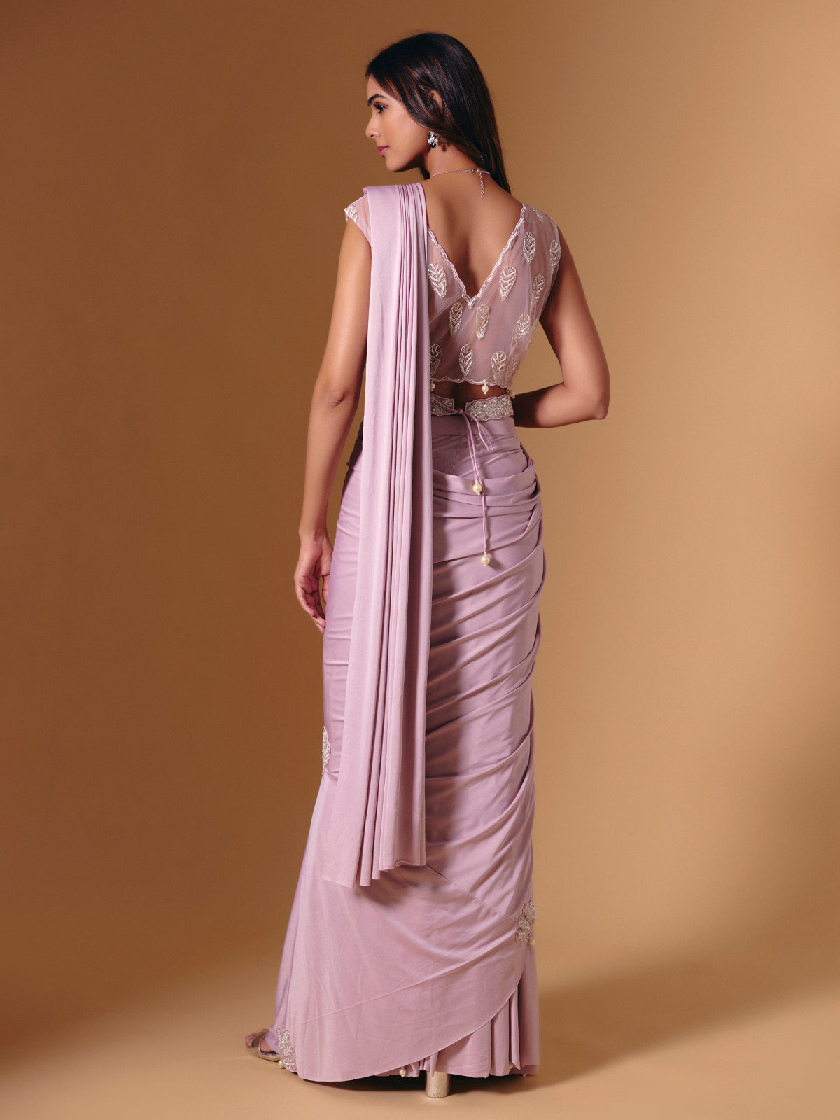 Light pink lycra saree with shimmering pearl accents