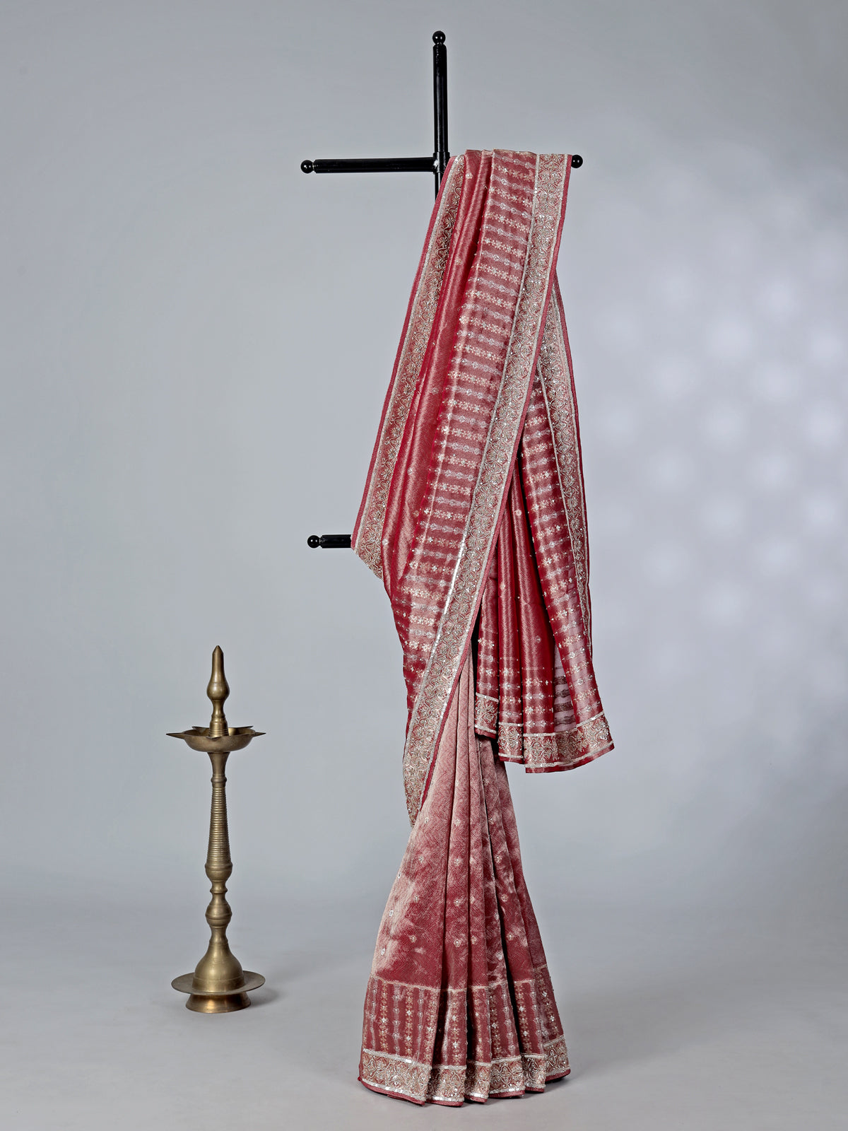 Maroon tissue saree with zardosi and cutdana work