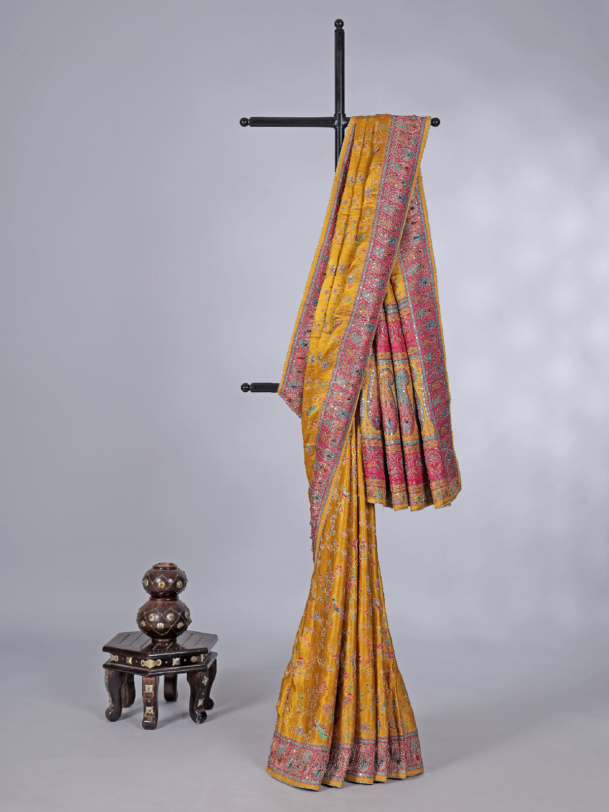 Mustard yellow modal silk saree with colorful motifs