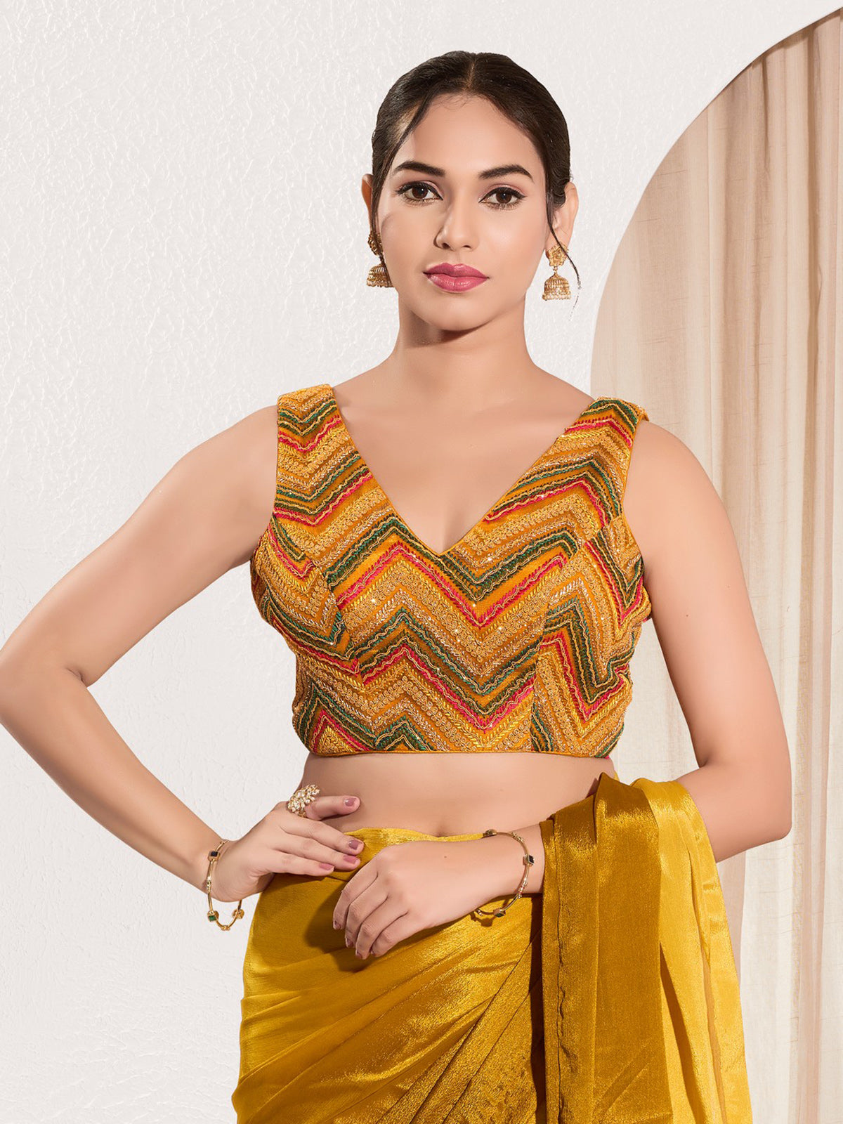 Mustard yellow net sleeveless festive blouse