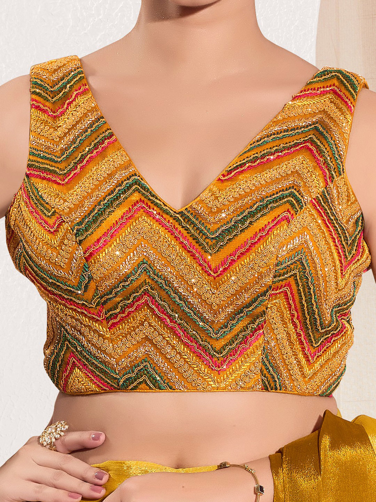 Mustard yellow net sleeveless festive blouse
