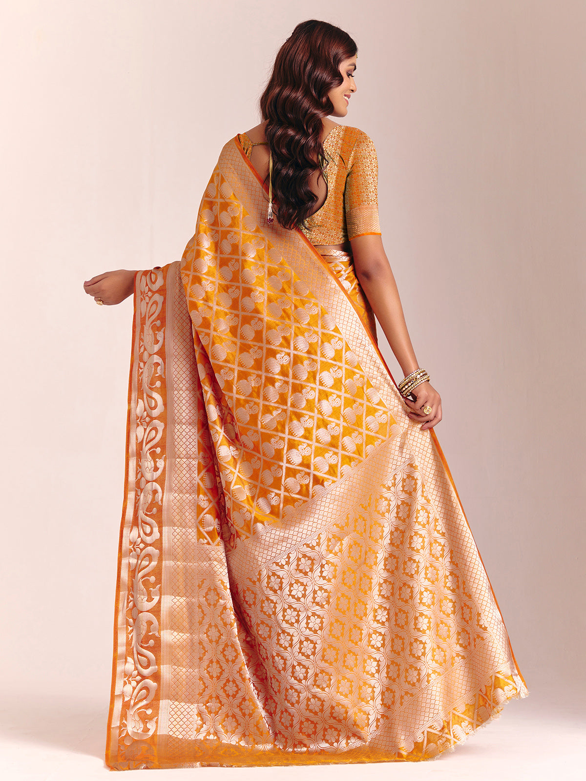 Mustard yellow silk saree with rich zari craftsmanship