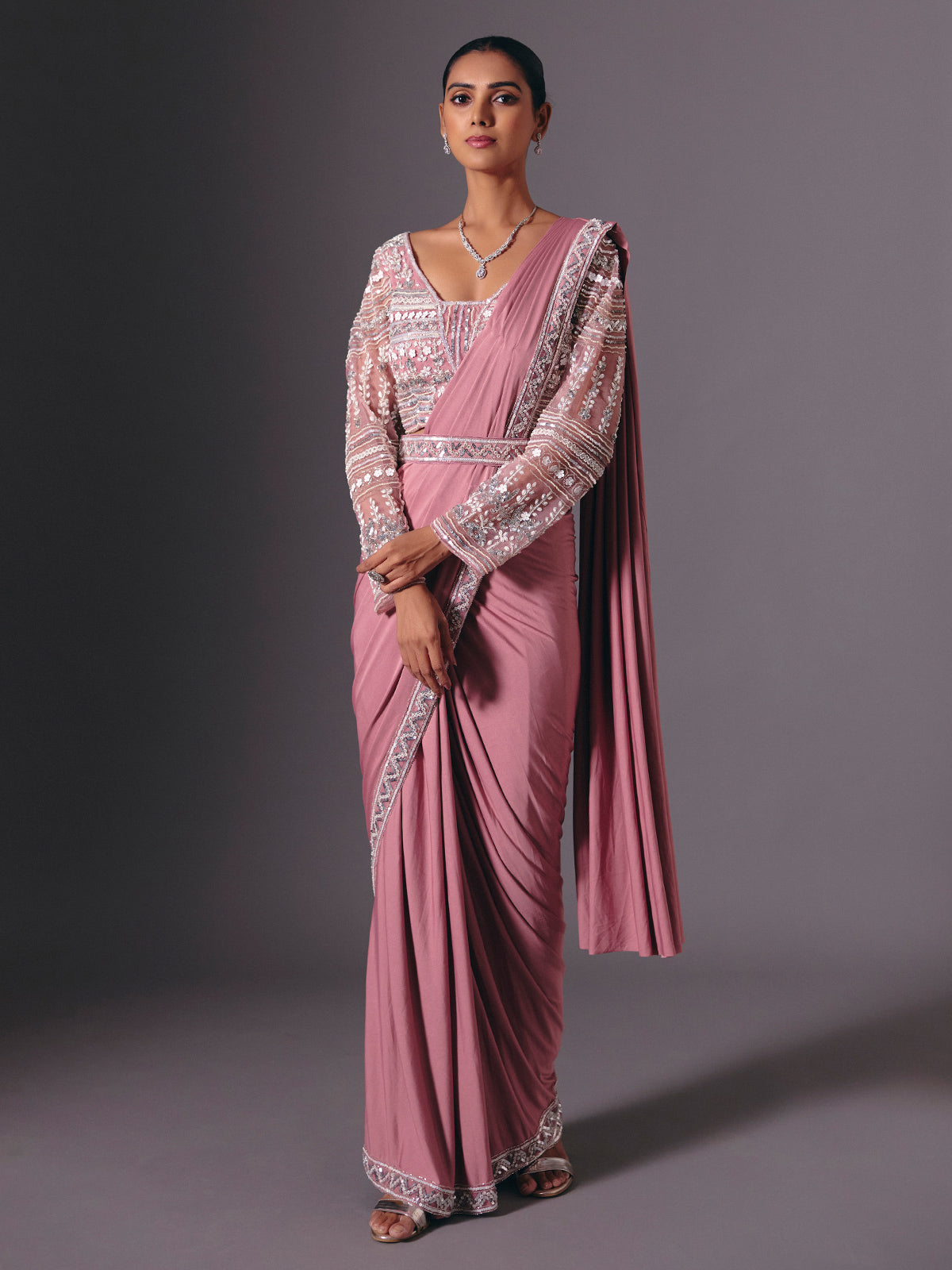 Onion pink lycra saree with heavy festive embellishments