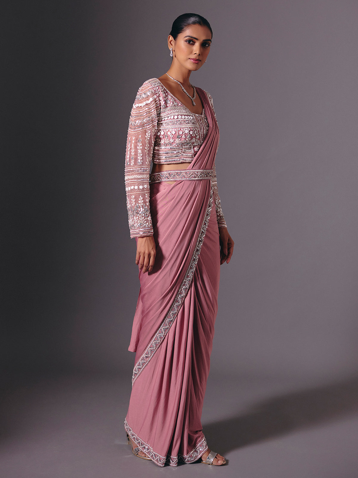 Onion pink lycra saree with heavy festive embellishments