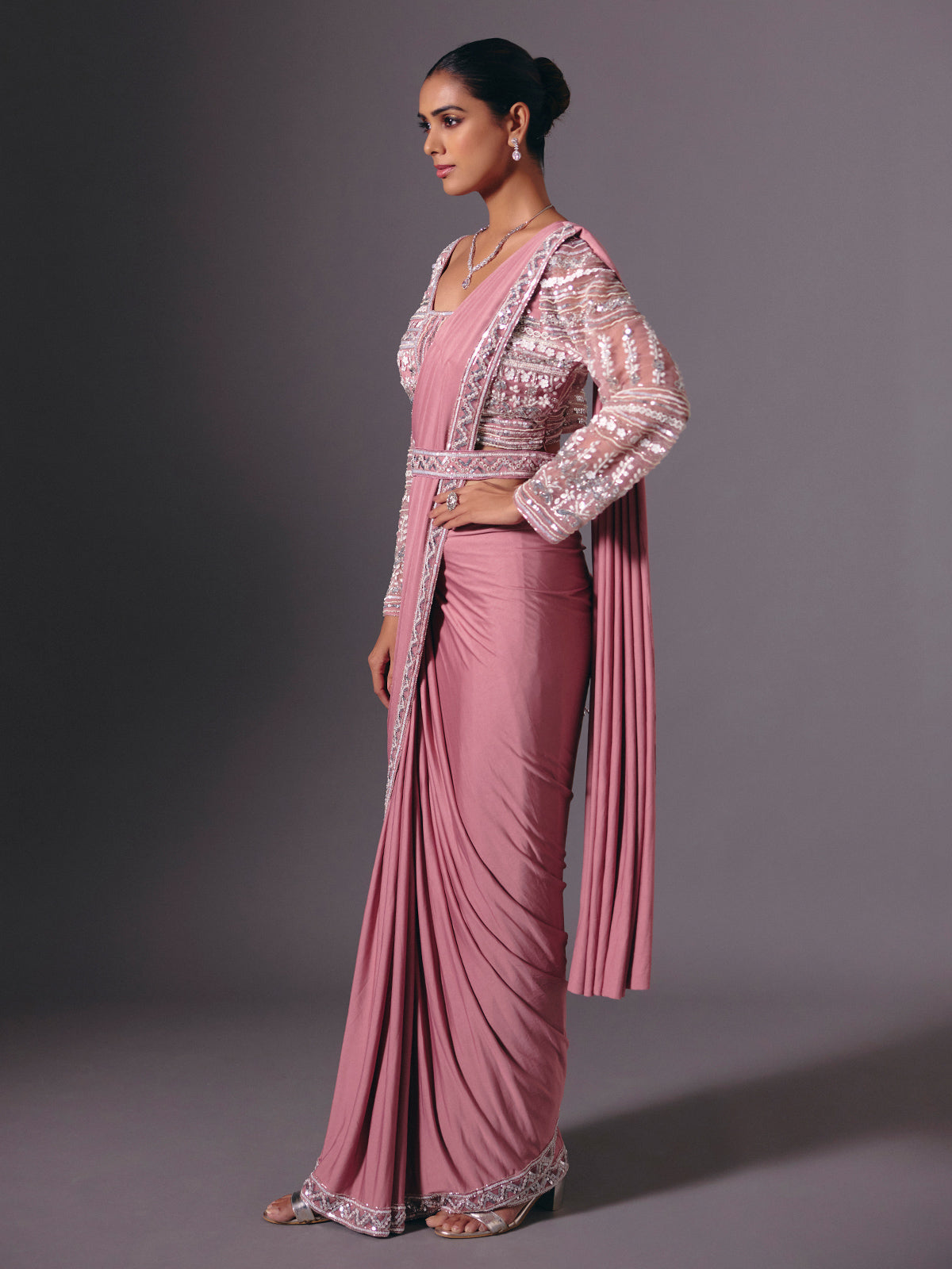 Onion pink lycra saree with heavy festive embellishments