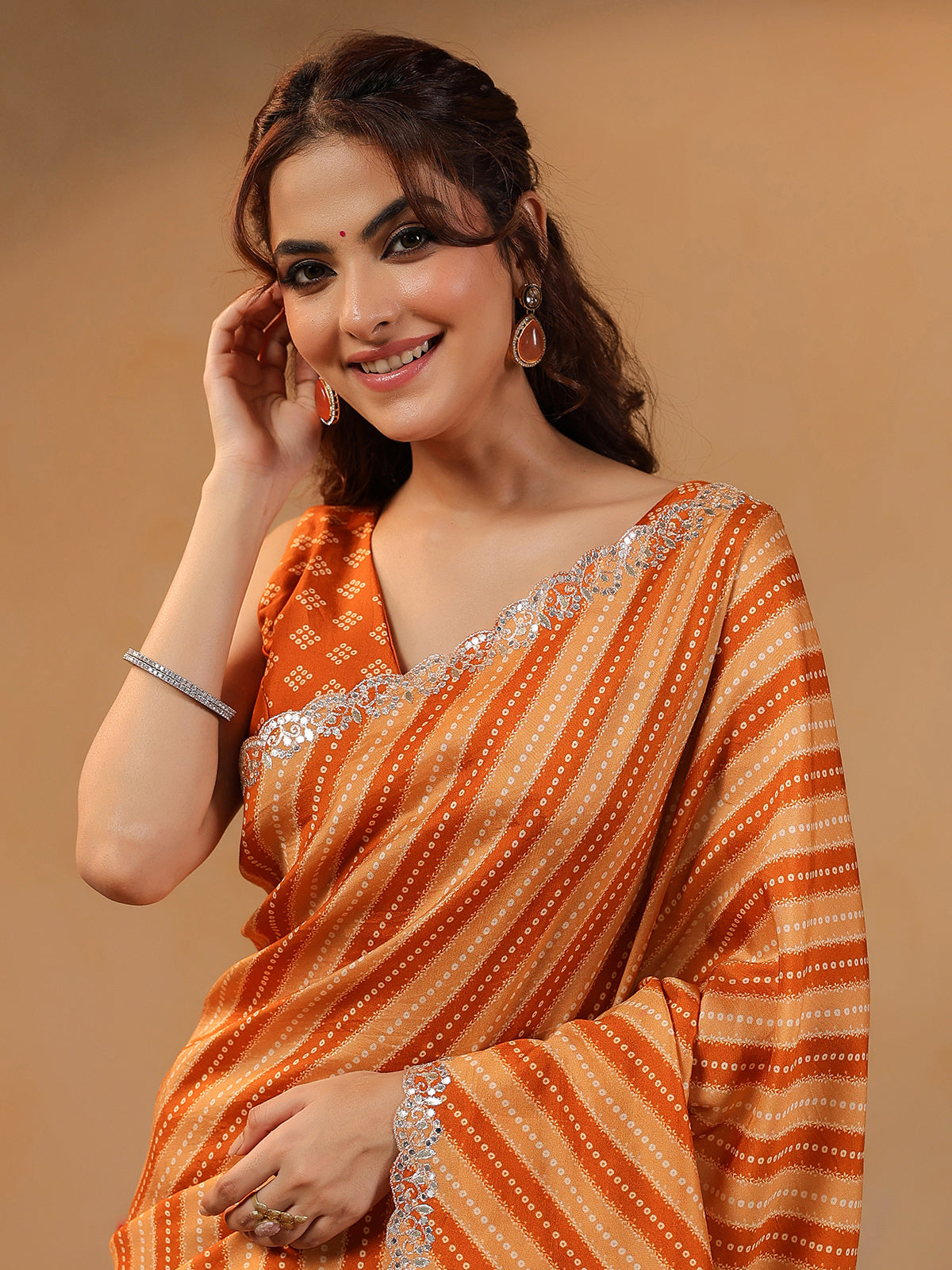 Orange printed silk saree with aabla accents