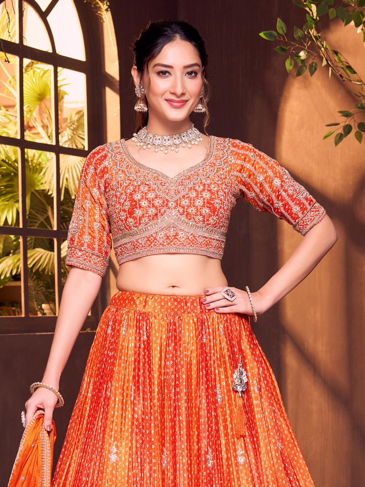 Orange silk bandhej elbow sleeve lehenga choli