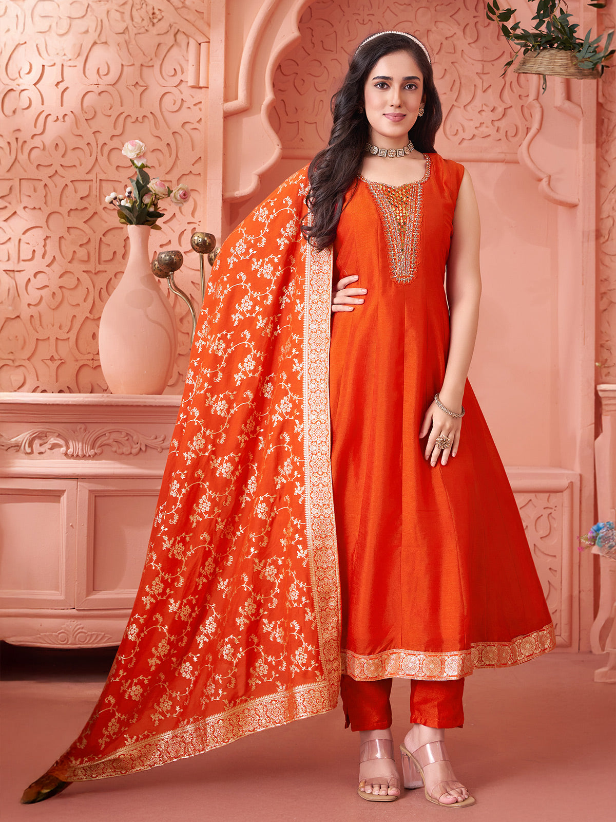 Orange silk salwar suit with shimmering zari and mirror glow