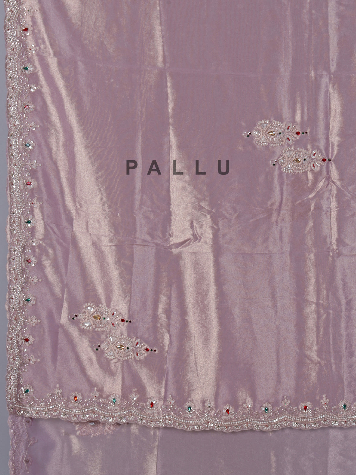 Pastel purple tissue silk saree with stone embellishments