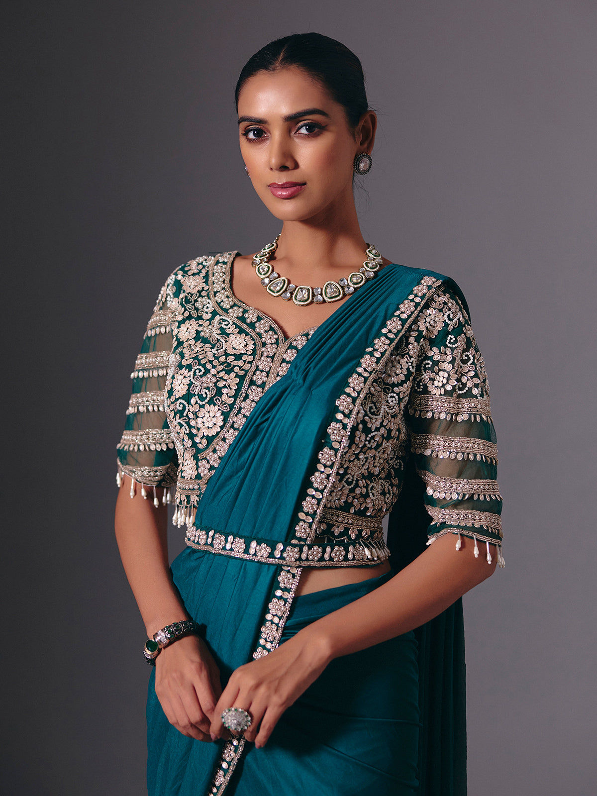 Rama green lycra saree with heavy work detailing