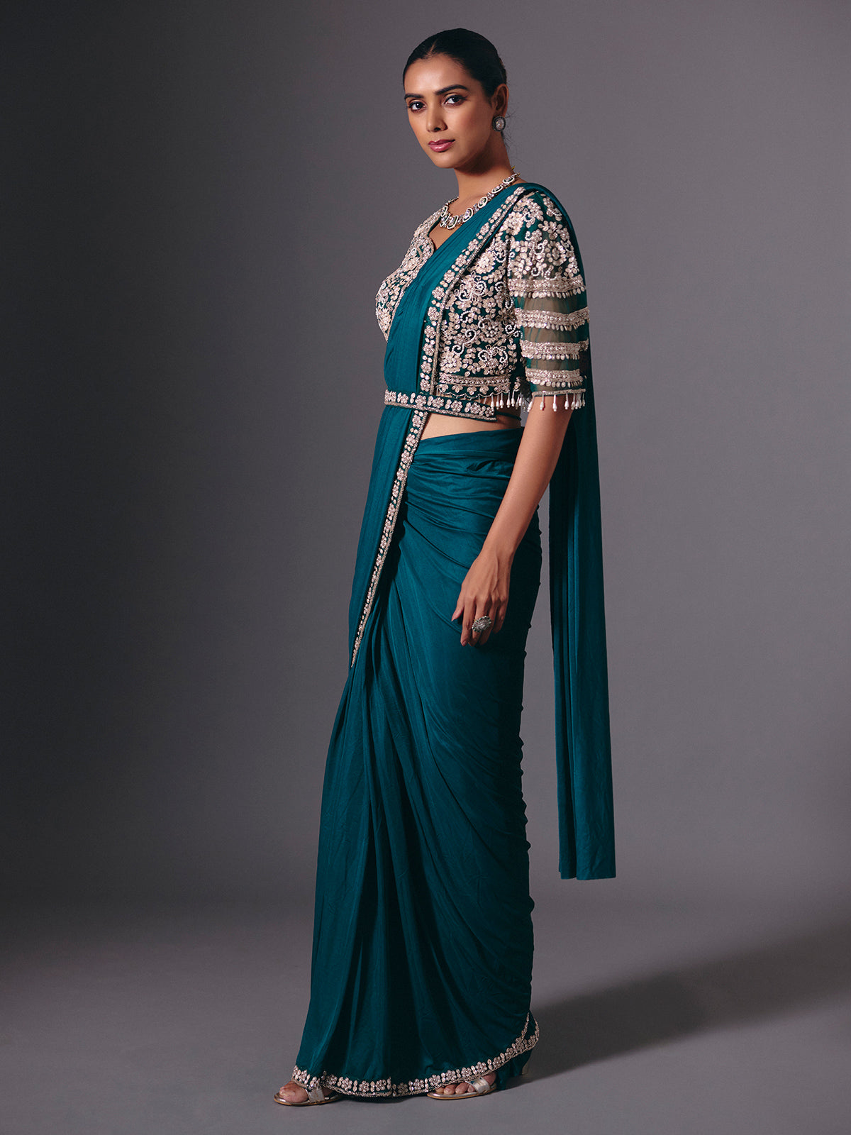 Rama green lycra saree with heavy work detailing