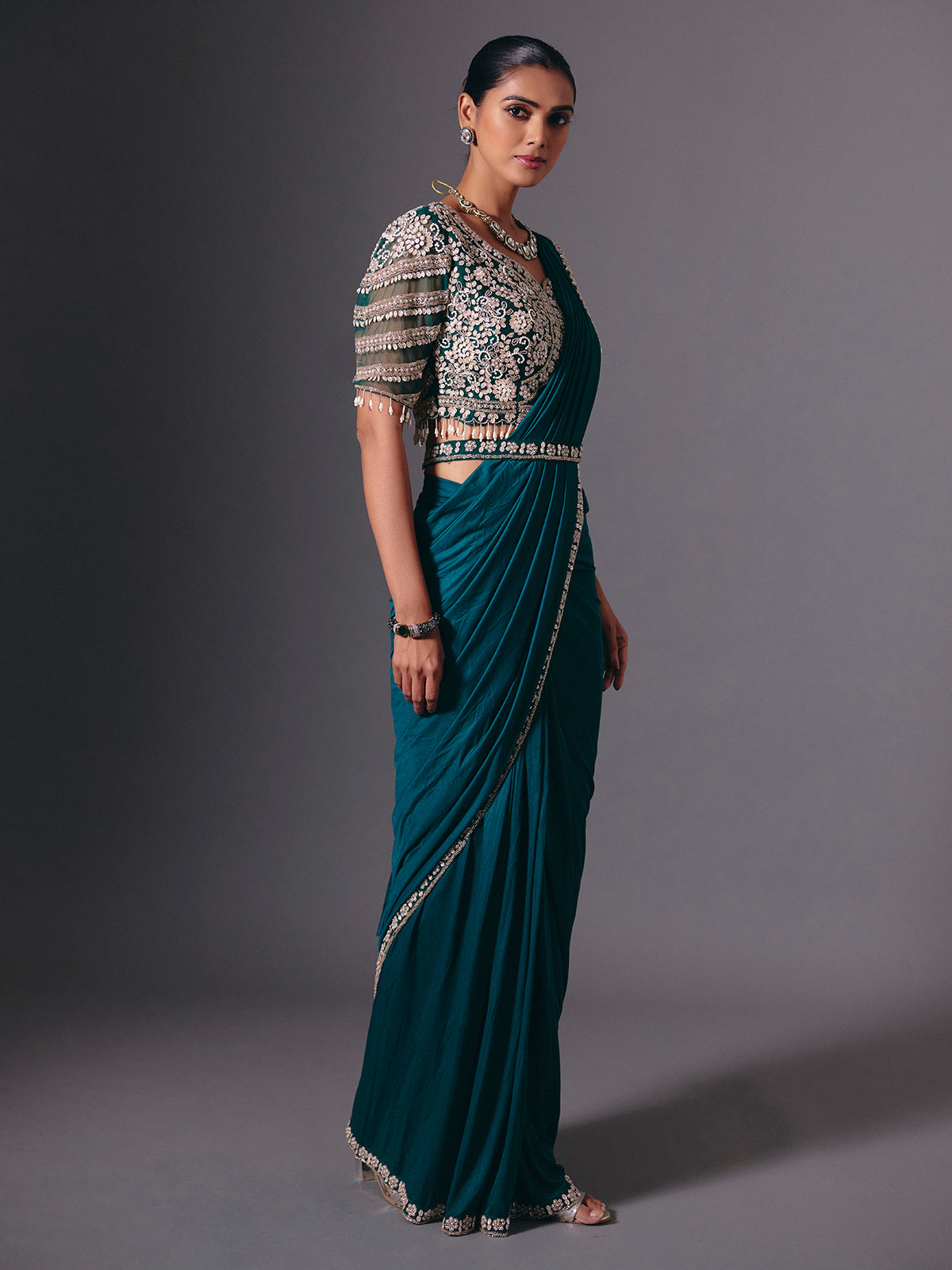 Rama green lycra saree with heavy work detailing