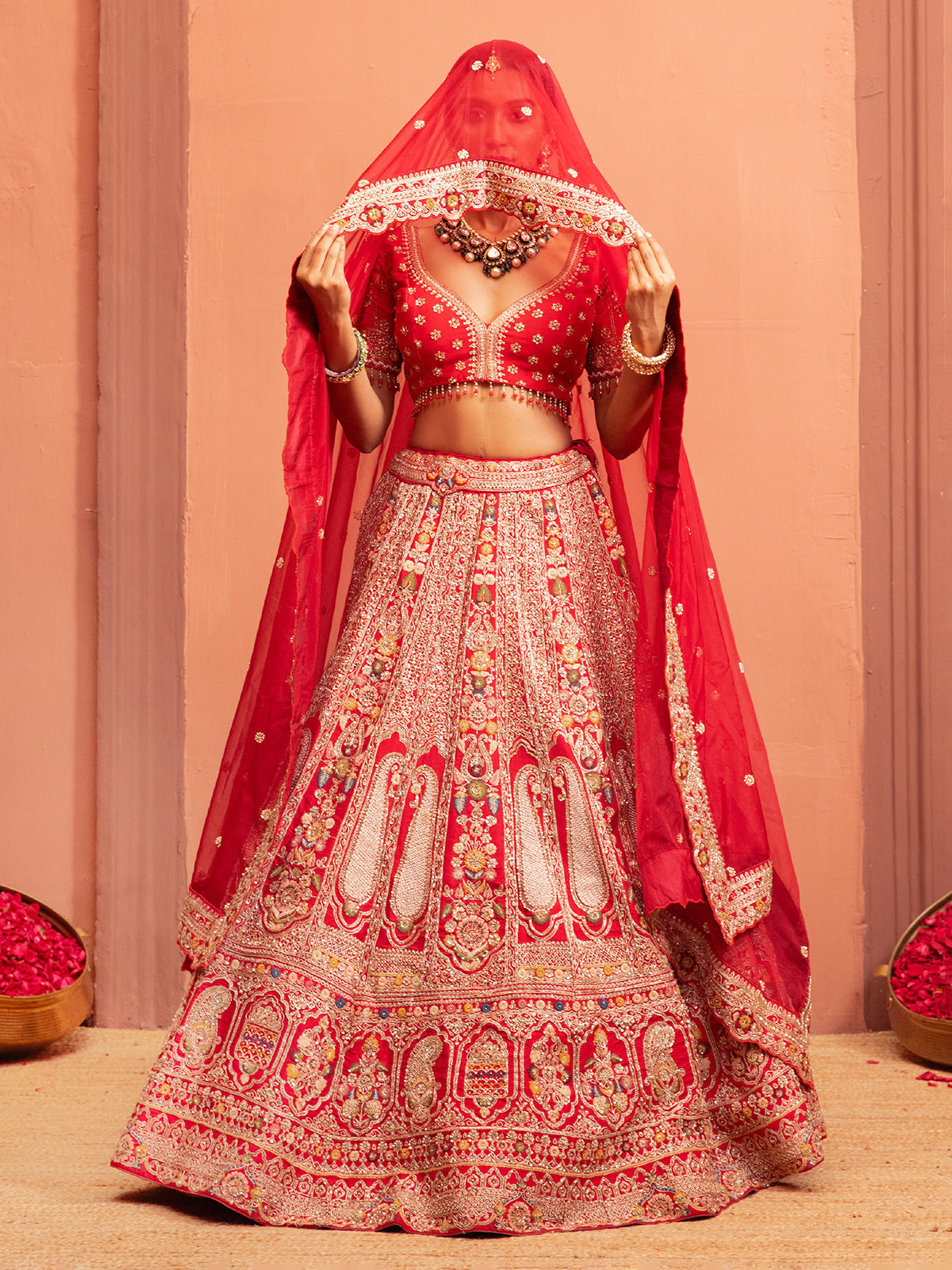 Red bridal lehenga choli with embellished blouse