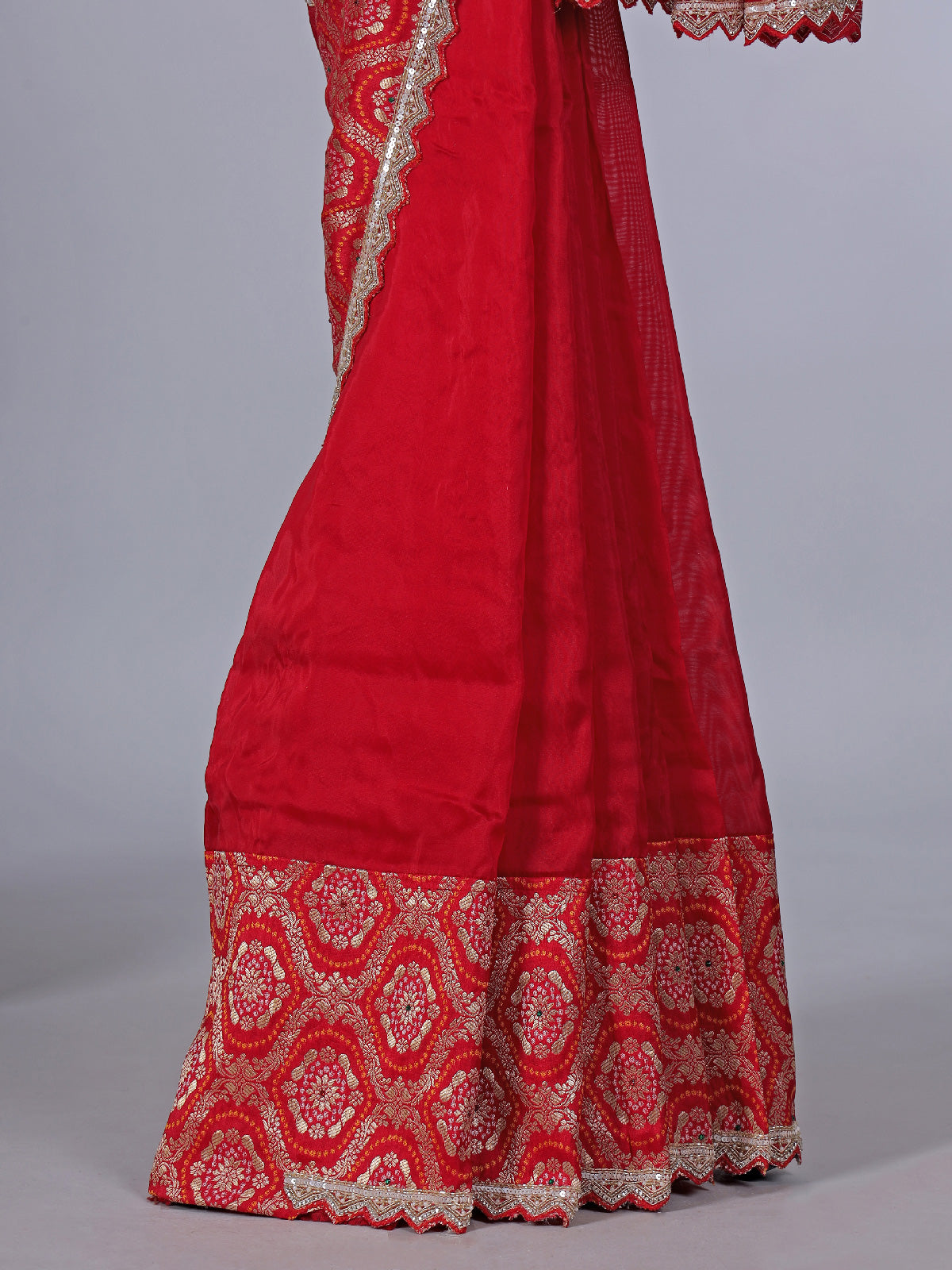Red dola silk saree with sparkling festive embellishments