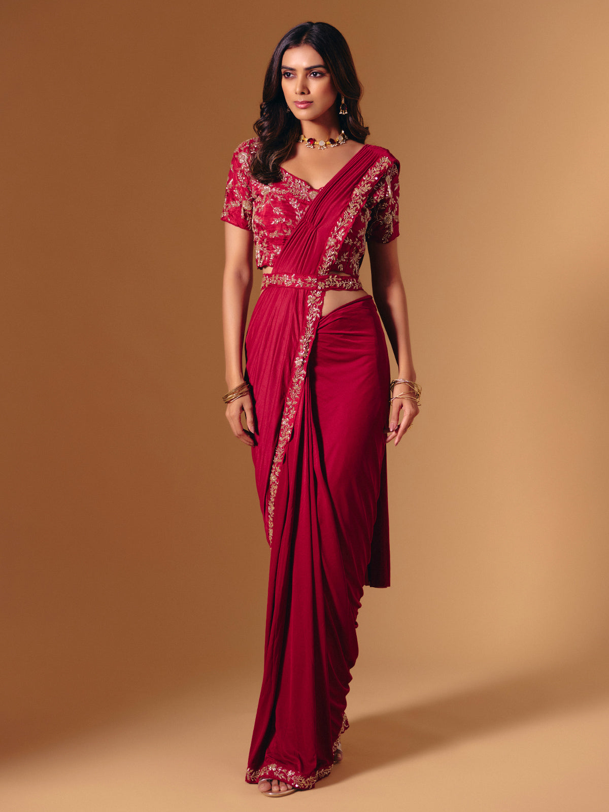 Red satin lycra saree with dazzling cutdana accents