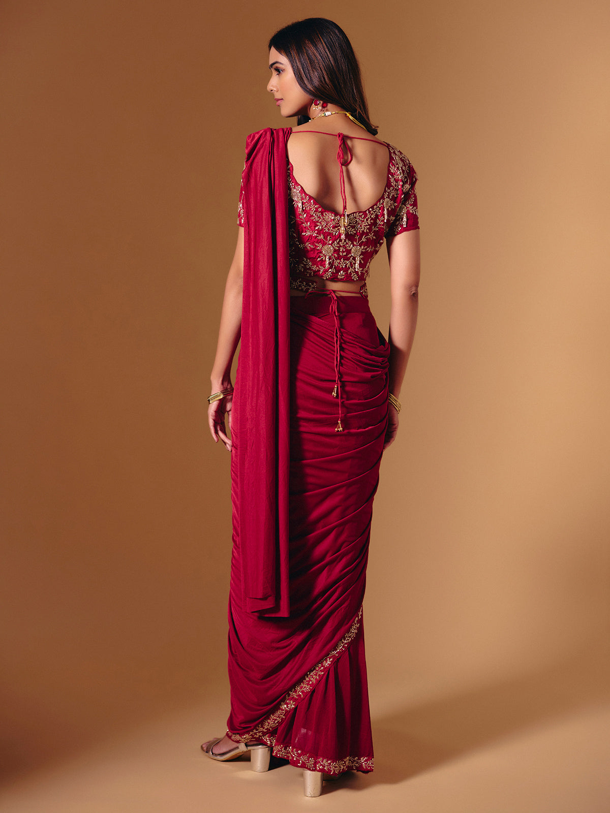 Red satin lycra saree with dazzling cutdana accents